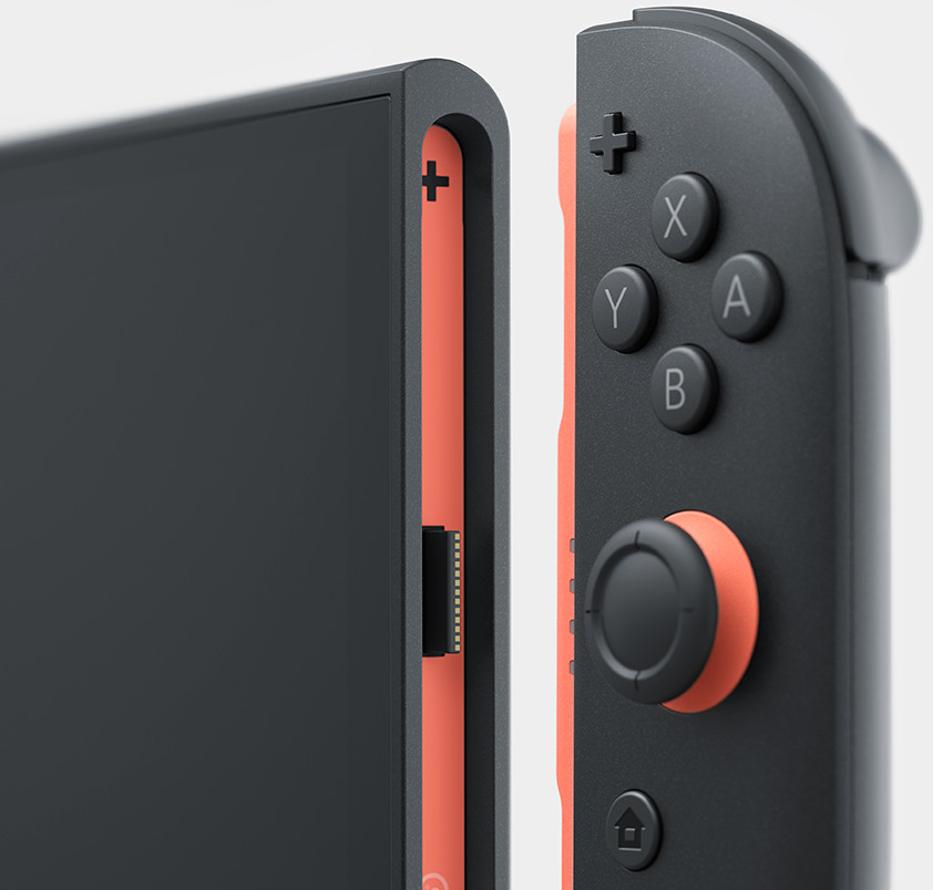 Een close-up van een Switch-controller. De linkerkant is zwart met een oranje rand. Knoppen zijn zichtbaar.