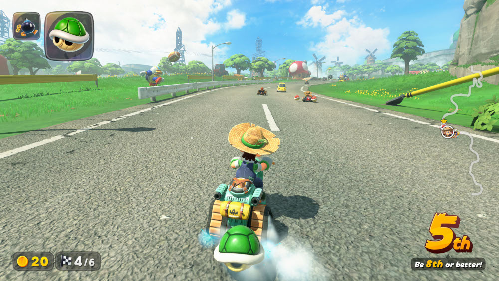 Een scherm van een videogame toont een personage dat een kart bestuurt op een weg met andere racers.