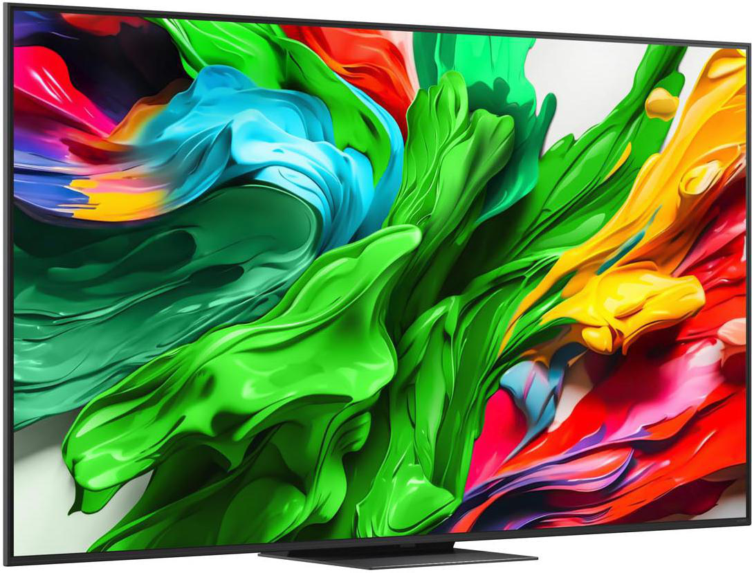 Großer Fernseher zeigt abstrakte bunte Formen vor schwarzem Rahmen.