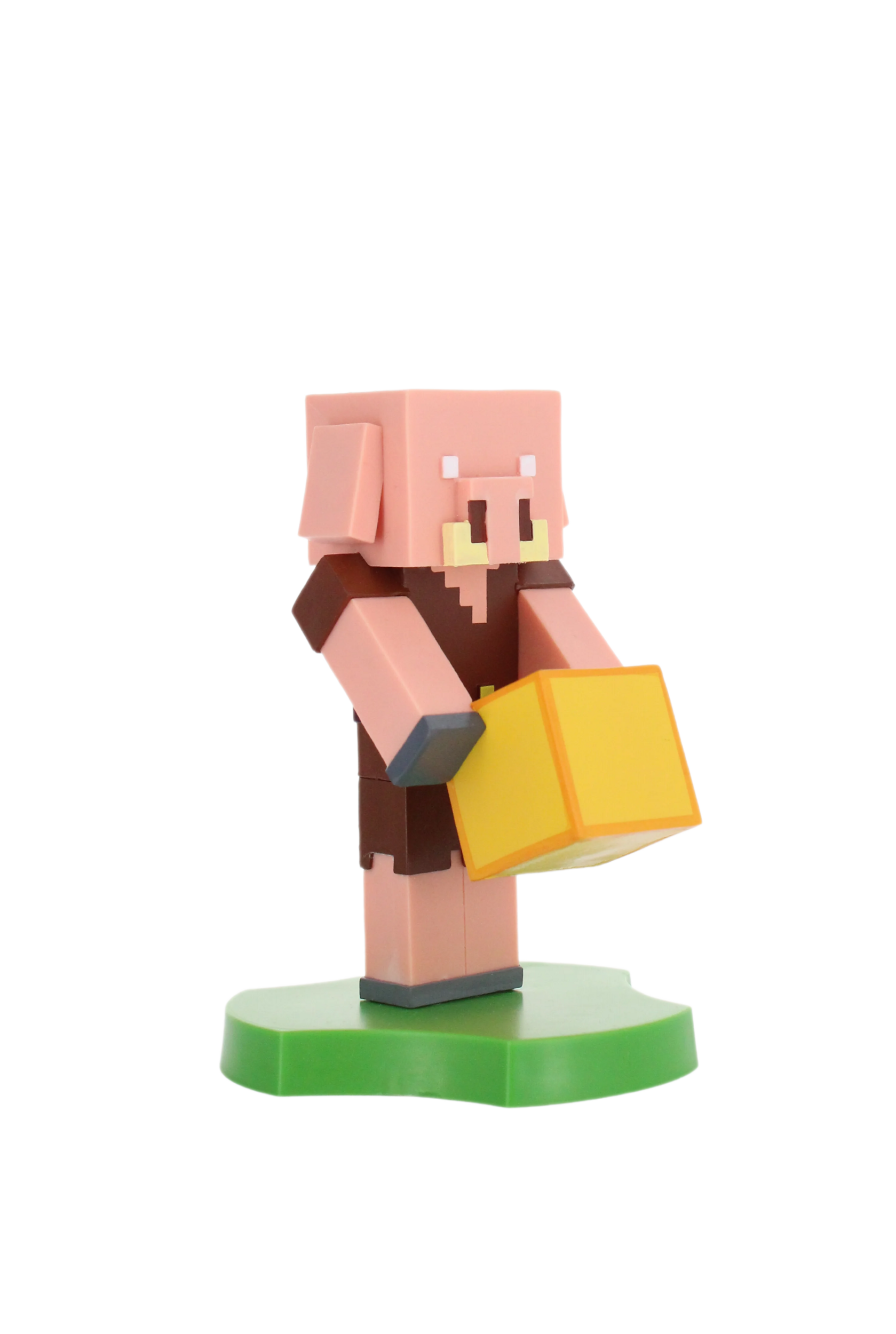 Ein Minecraft-Schwein-Charakter, der einen gelben Block hält, auf grüner Basis stehend.