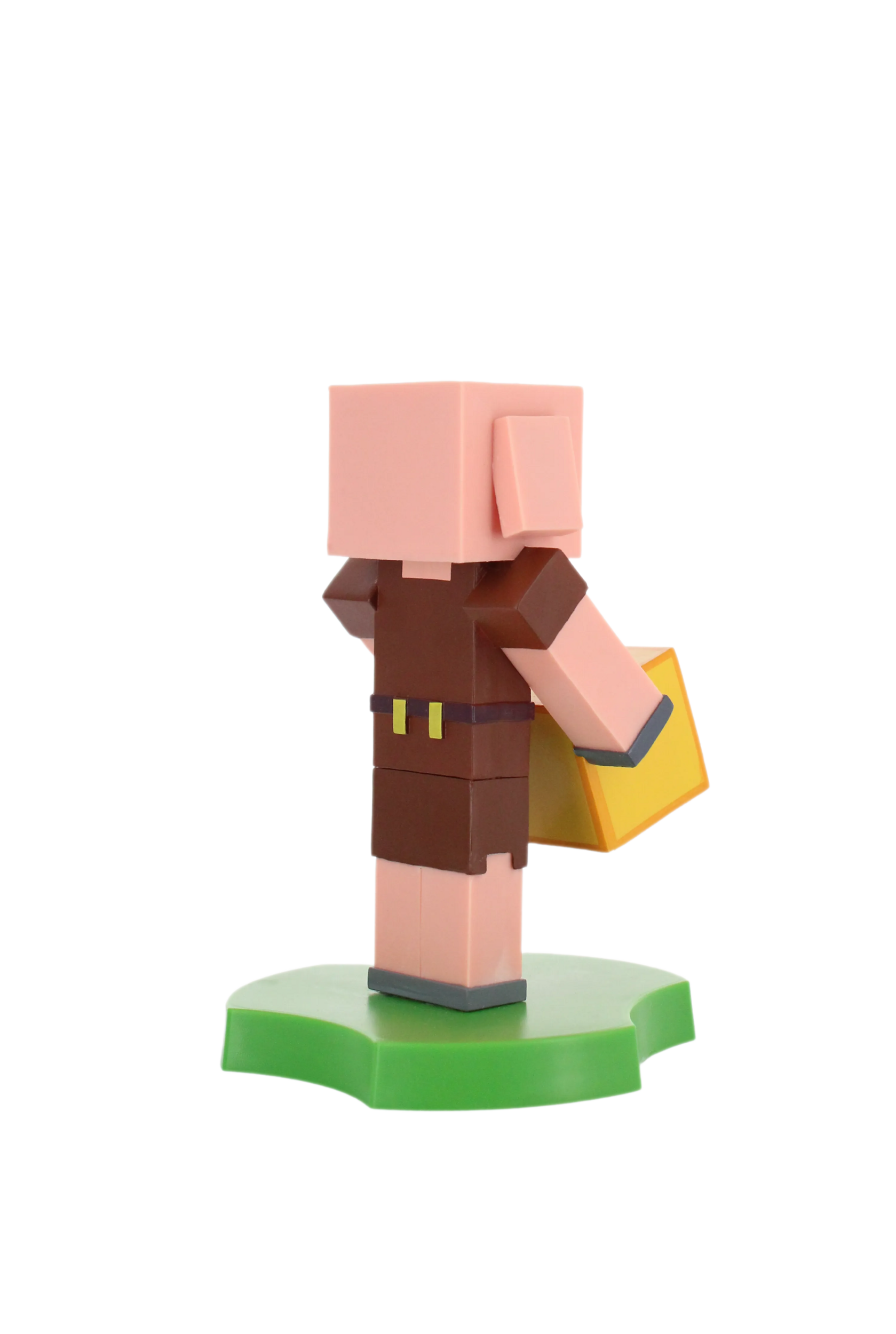 Eine Minecraft-Schweinfigur steht auf einer grünen Basis. Die Figur ist blockartig und verpixelt.