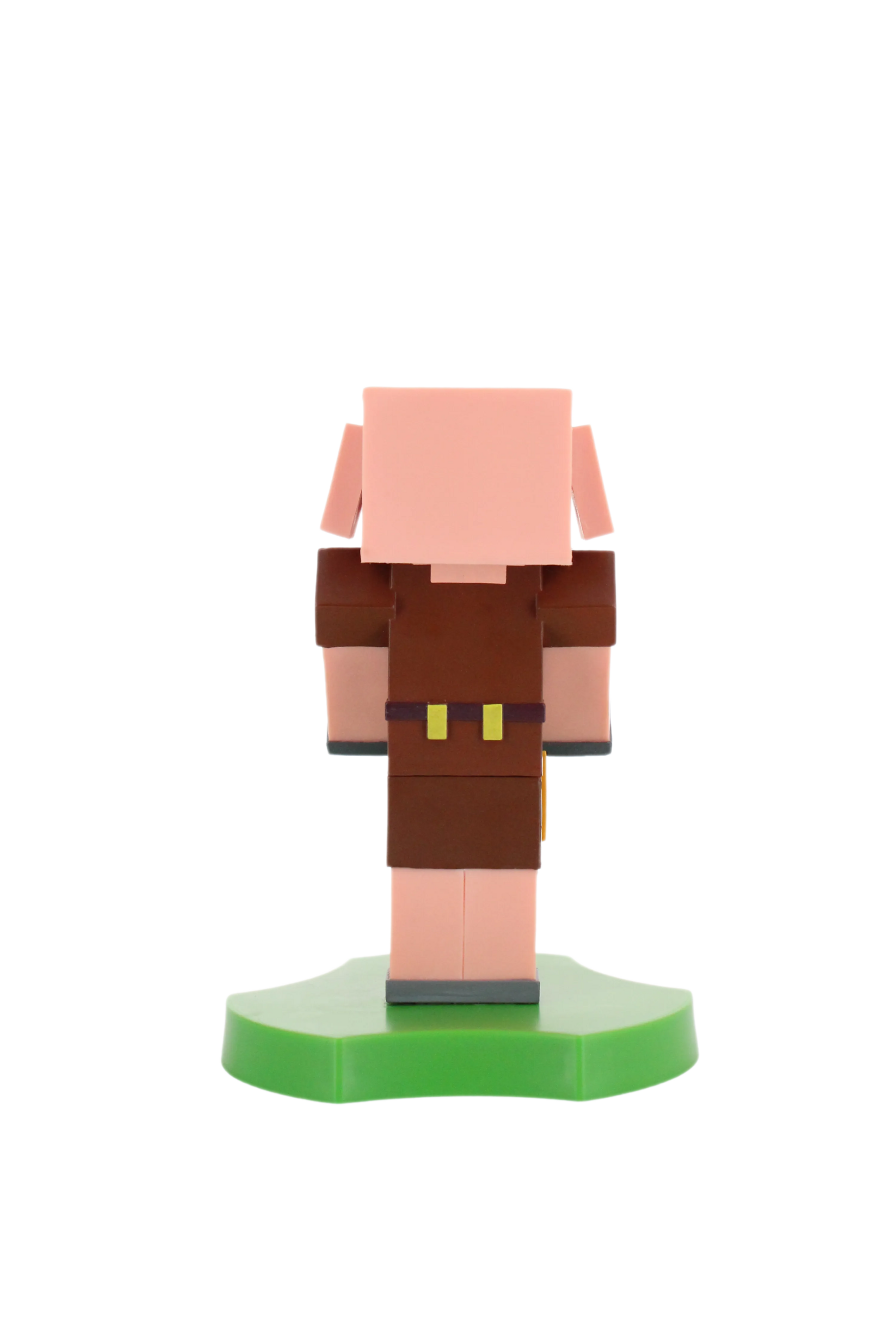 Eine Minecraft-Schwein-Figur, die auf einer grünen Basis steht, isoliert auf schwarzem Hintergrund.
