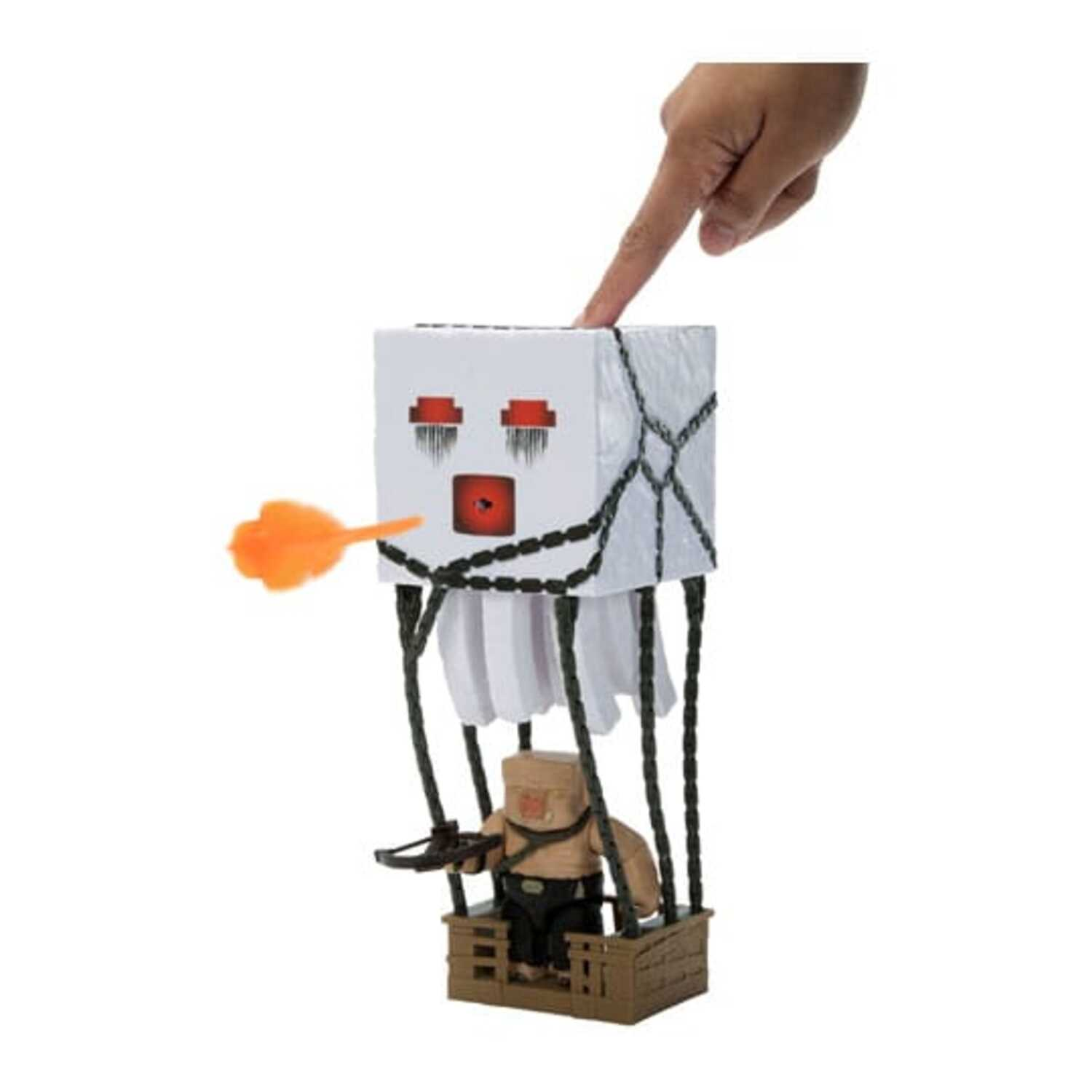 A hand points at a toy Minecraft Ghast in a hot air balloon.