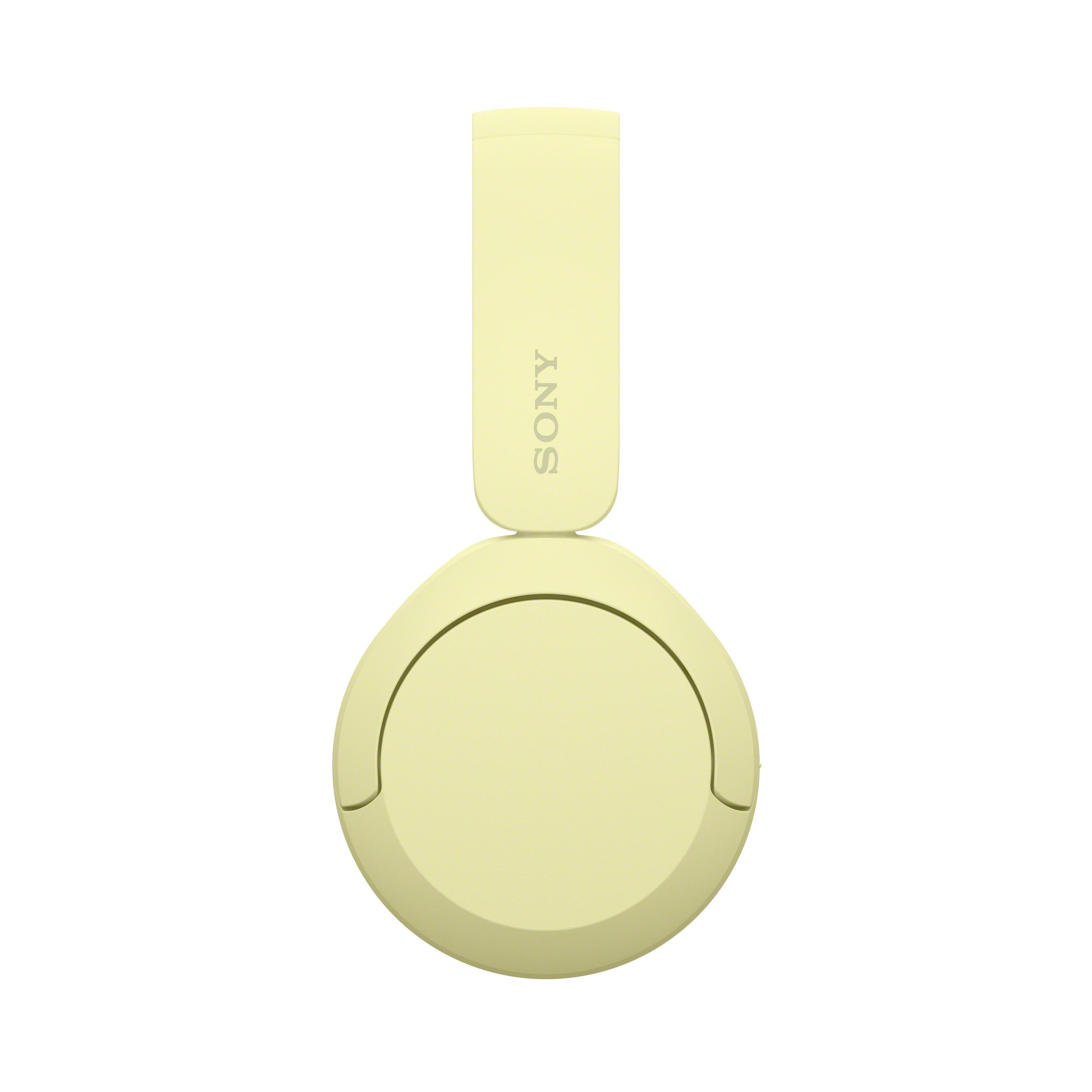 Żółte słuchawki Sony, widok z góry. Opaska ma logo Sony. Nauszniki są okrągłe.