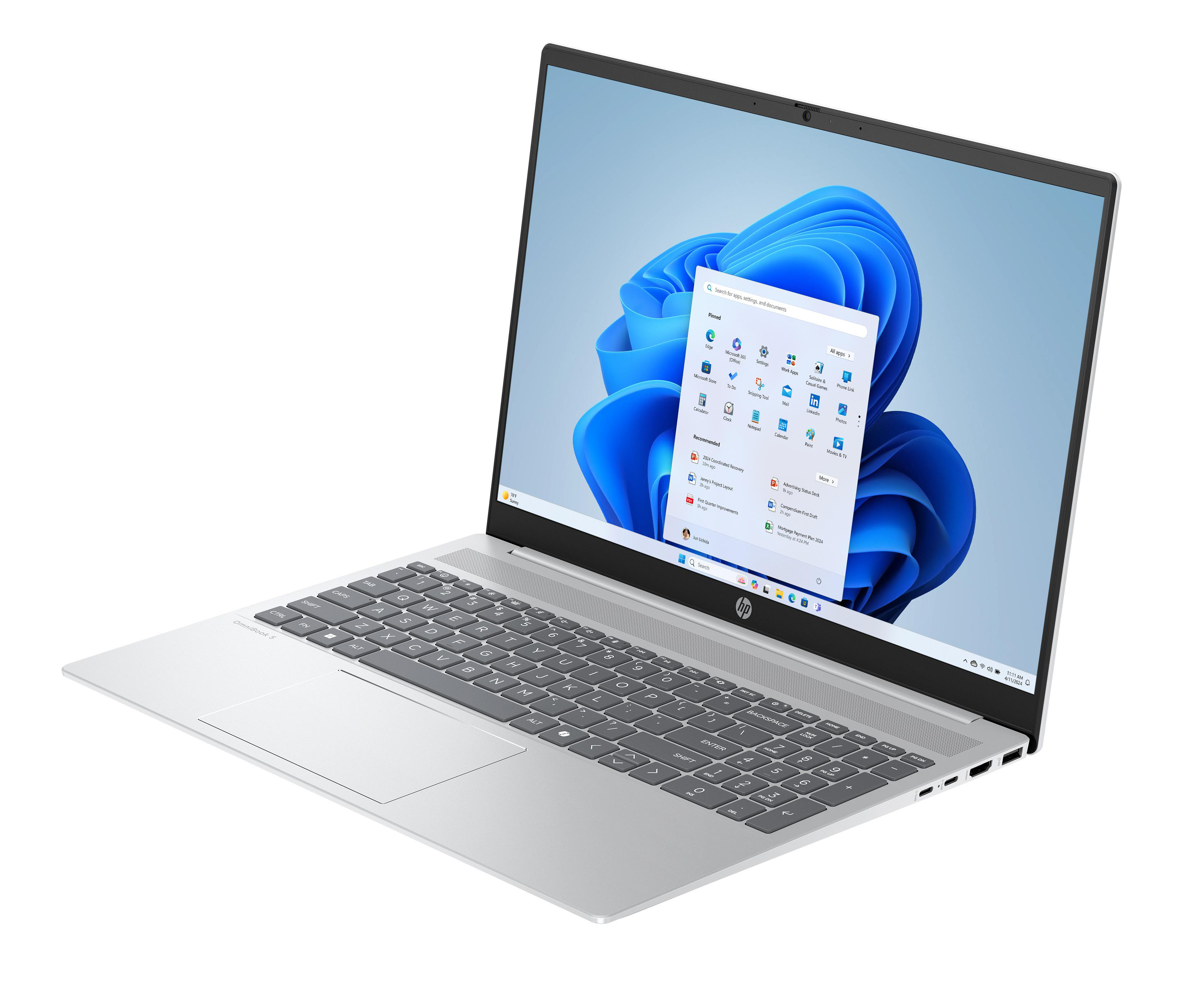 Ein silberner Laptop mit Windows 11 Oberfläche und blauem Hintergrund. Der Laptop ist geöffnet.