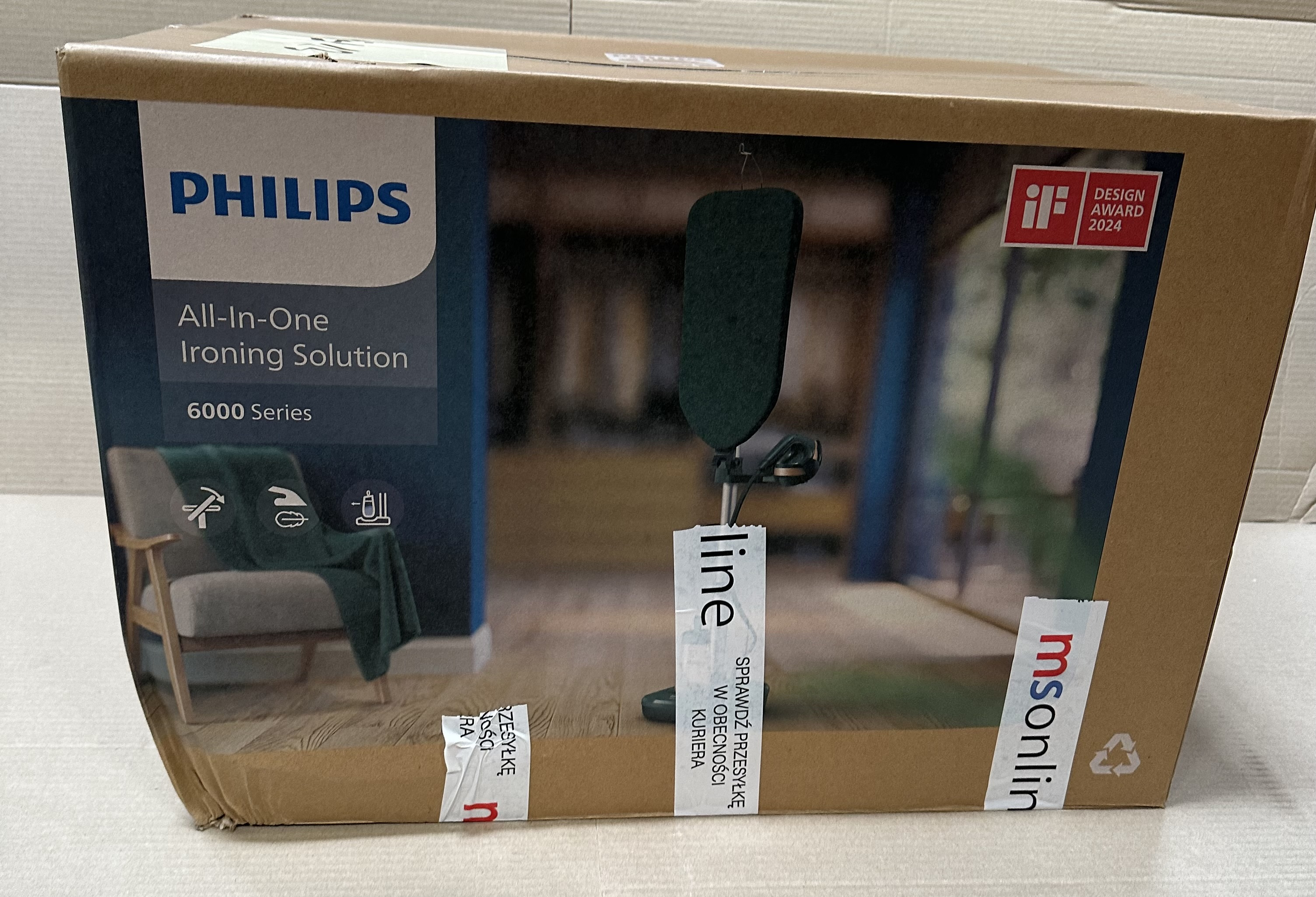 Pudełko ze zdjęciem rozwiązania do prasowania Philips, z tekstem i odznaką nagrody za design.