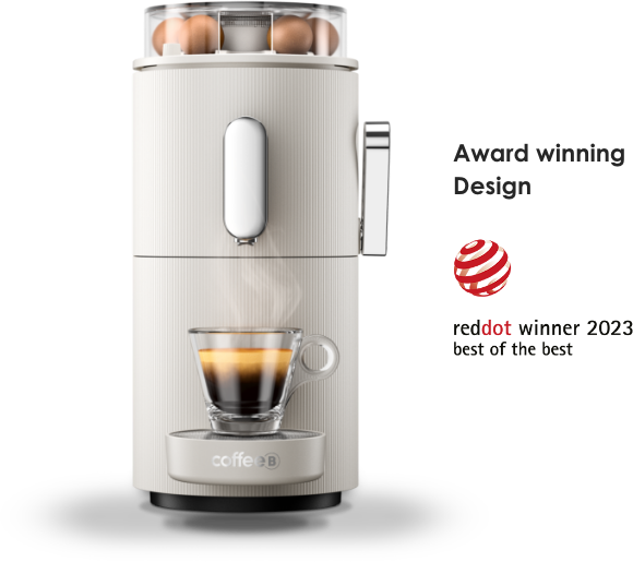 Macchina da caffè con uova sopra e una tazza di caffè. Vincitore del premio Red Dot.