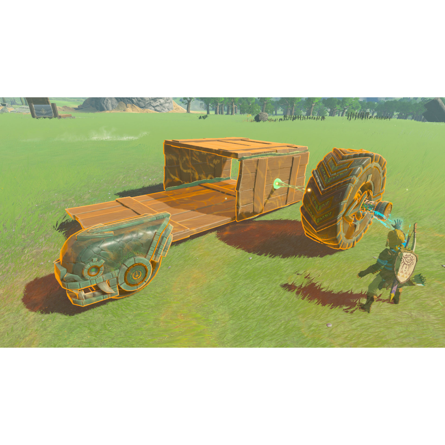 A character building a vehicle in a video game, on a green field.