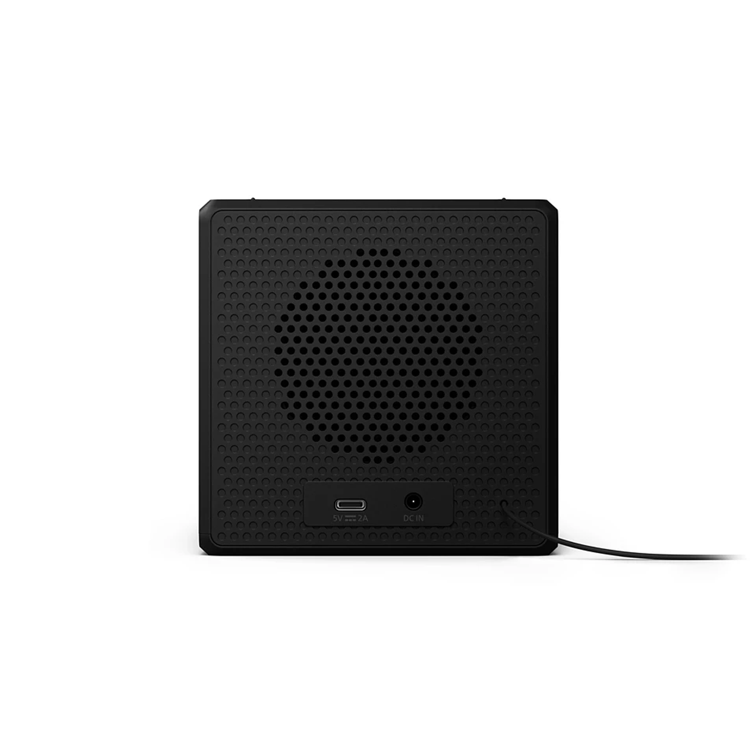 A black speaker with a perforated front. It has a USB port and a DC input. A black cable extends from the bottom.