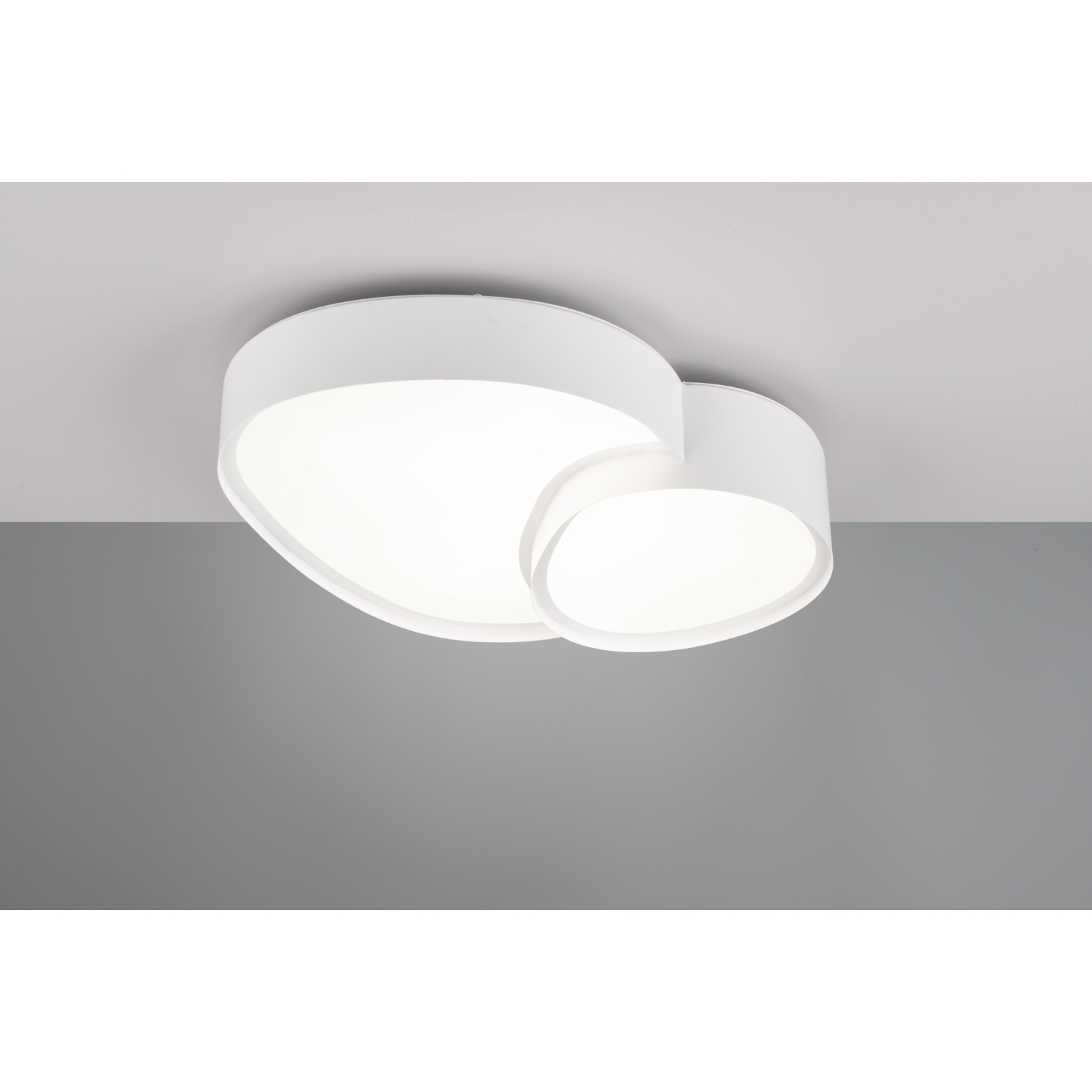 Un apparecchio di illuminazione a soffitto bianco con due forme ovali interconnesse.