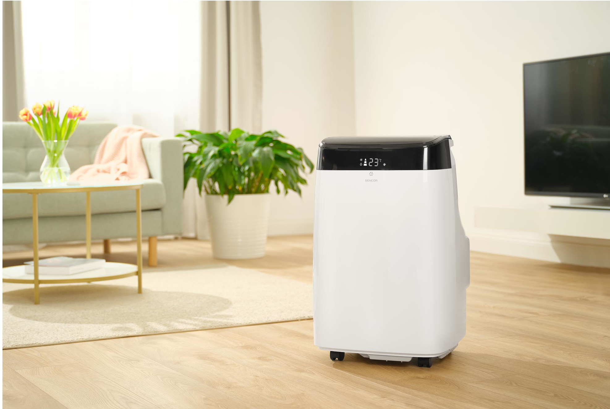 Biały oczyszczacz powietrza w salonie.