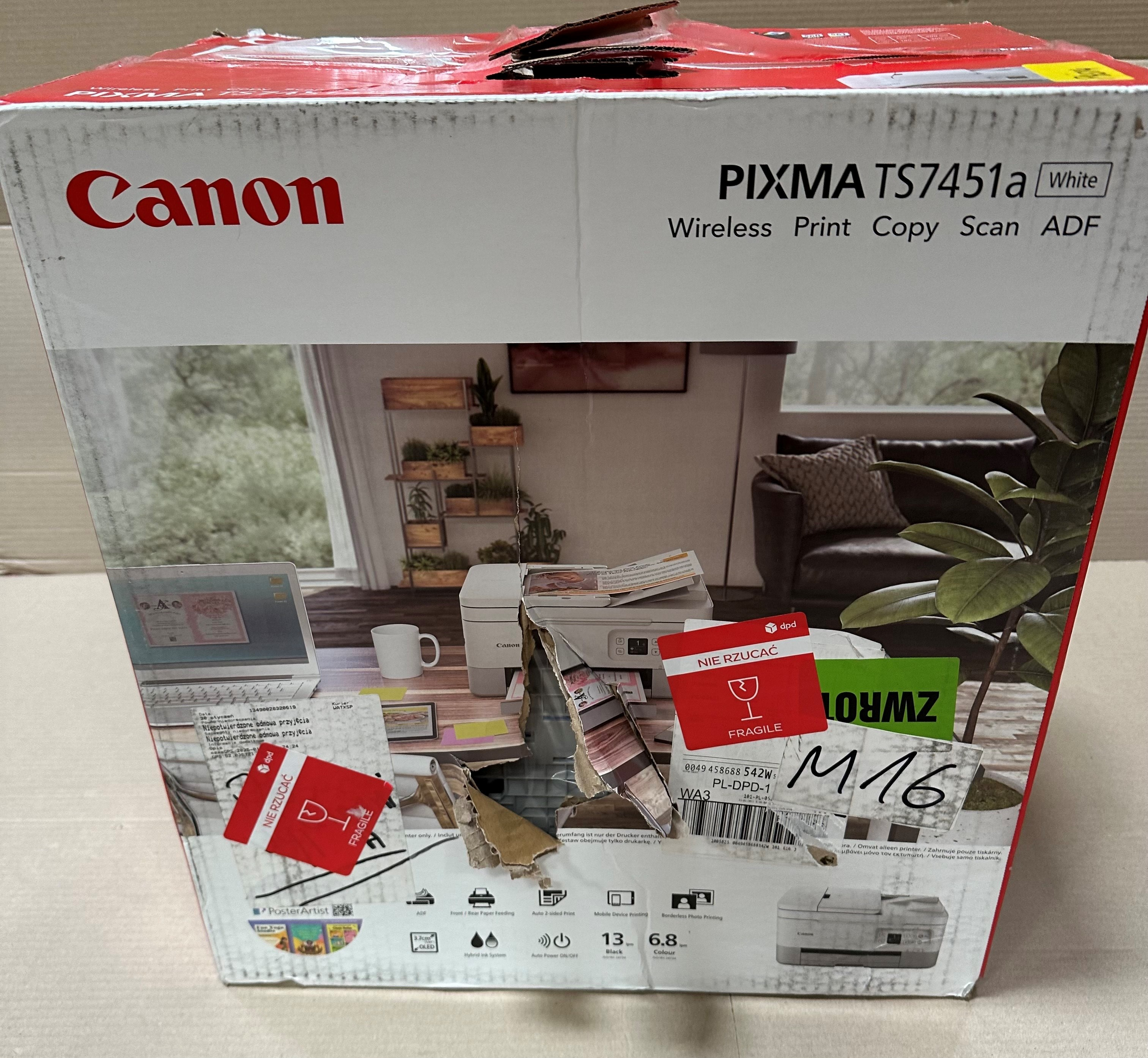 Pudełko drukarki Canon z drukarką w środku. Prezentacja drukarki i akcesoriów.