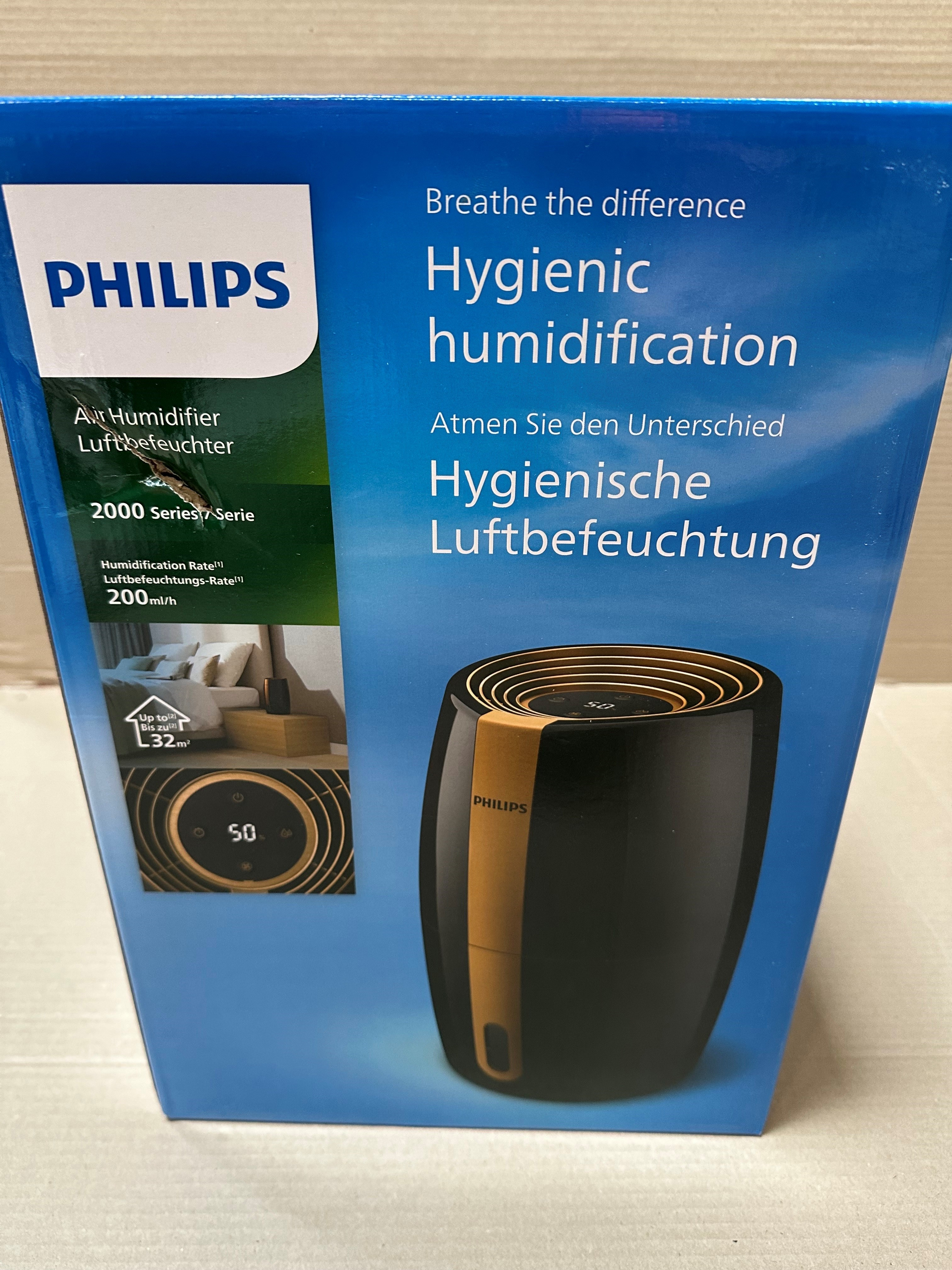 Niebieskie pudełko z nawilżaczem Philips, zdjęciem produktu i tekstem opisu.