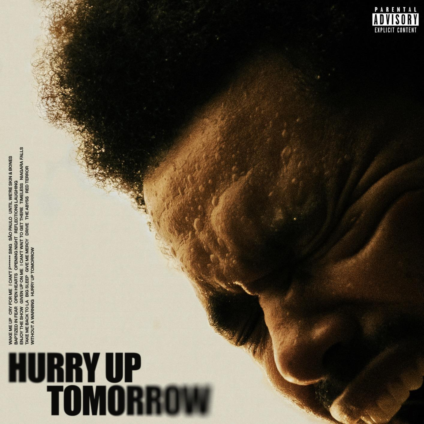 Pochette d'album avec visage d'homme ombragé. Texte 'Hurry Up Tomorrow' en dessous. Label Parental Advisory présent.