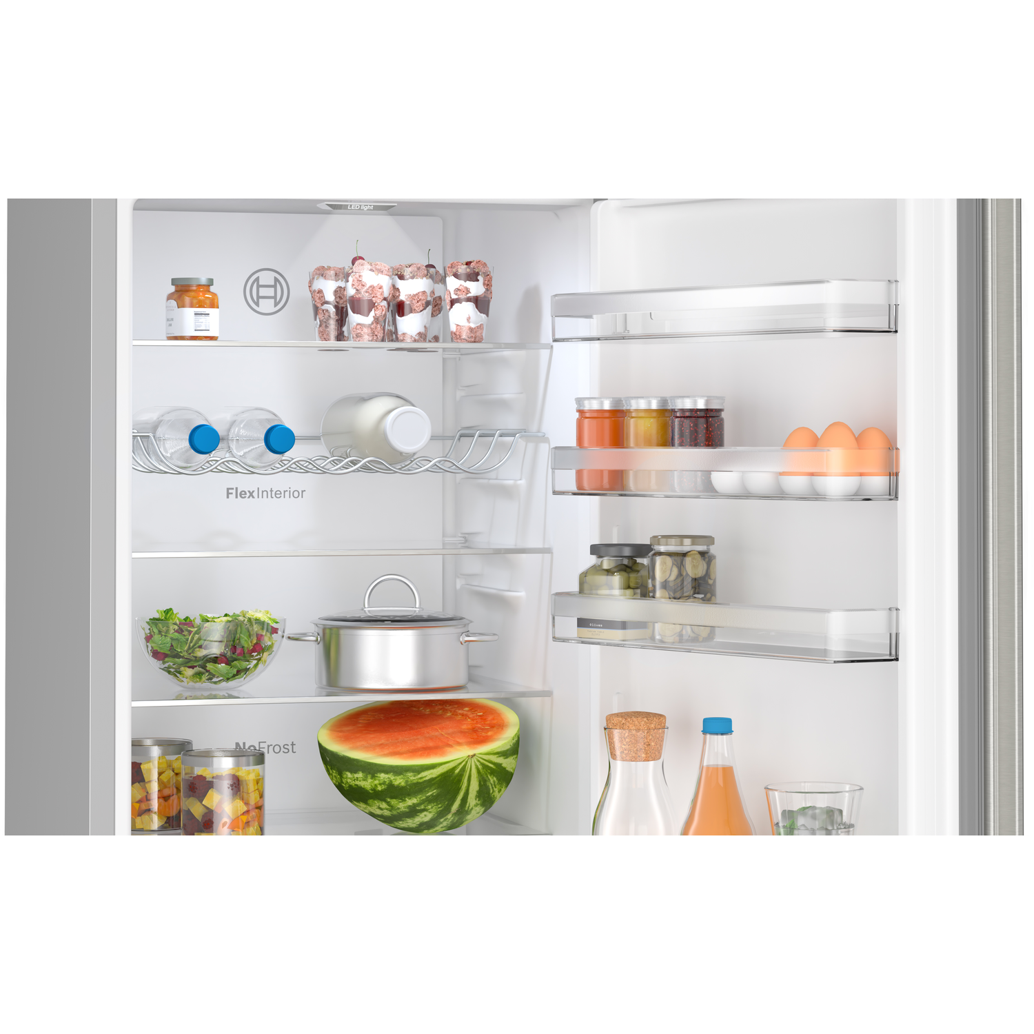 Open refrigerator with food inside: jars, water bottles, watermelon, and other items.