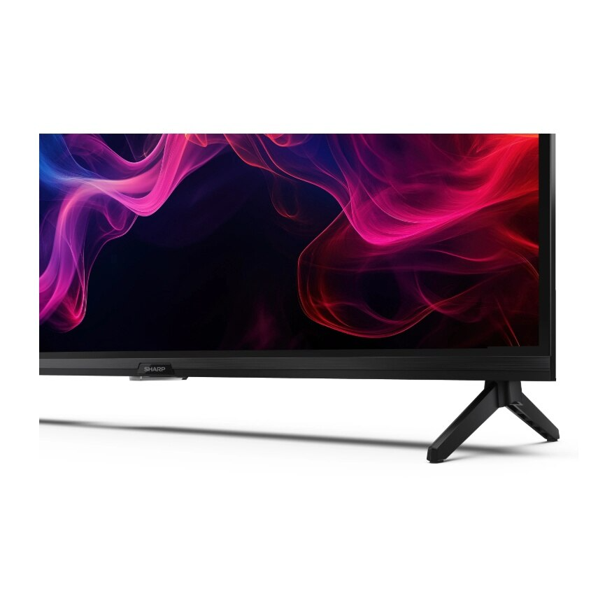 Egy Sharp TV, melynek képernyőjén színes absztrakt dizájn látható, fekete állvánnyal.