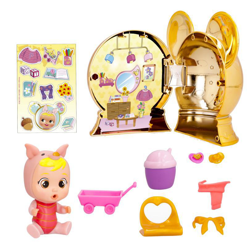 Ein goldenes Spielzeughaus mit Zubehör. Eine Puppe in rosa Outfit, Aufkleber und andere kleine Spielzeuge sind ebenfalls vorhanden.