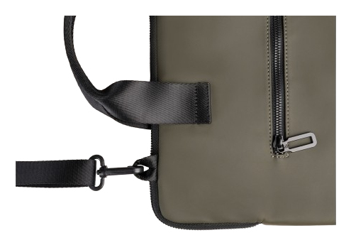 Nahaufnahme eines grünen und schwarzen Rucksacks mit Riemen und Reißverschluss.