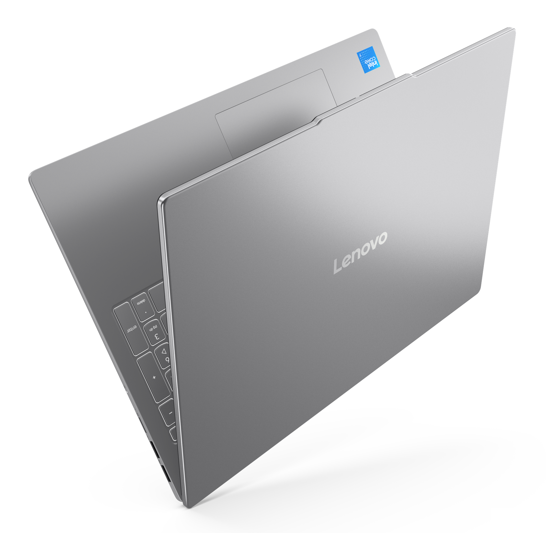 Srebrny laptop, widok z góry, na czarnym tle.