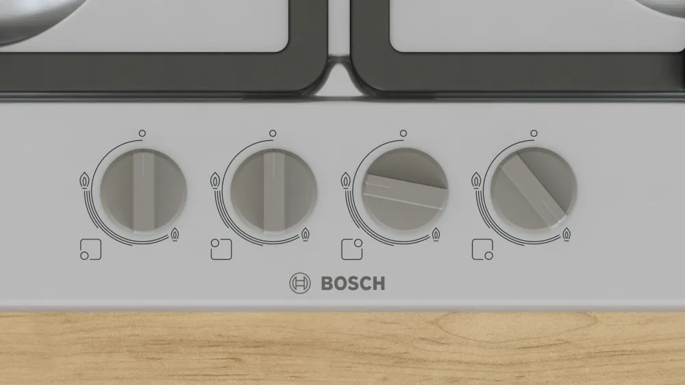Gáztűzhely közelképe négy szabályozógombbal, látható Bosch logóval.