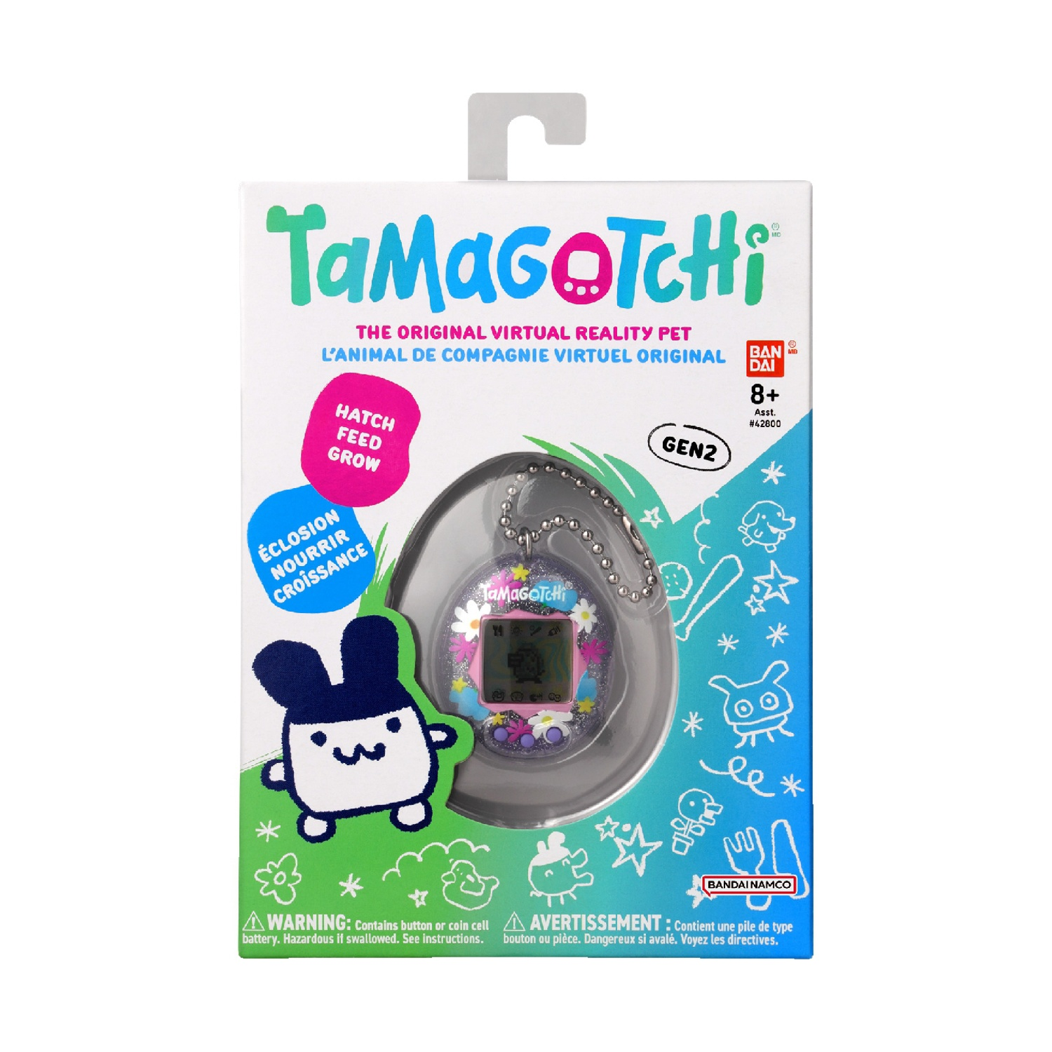 Scatola dei giocattoli Tamagotchi. Scatola con un Tamagotchi sul davanti. Sfondo colorato.