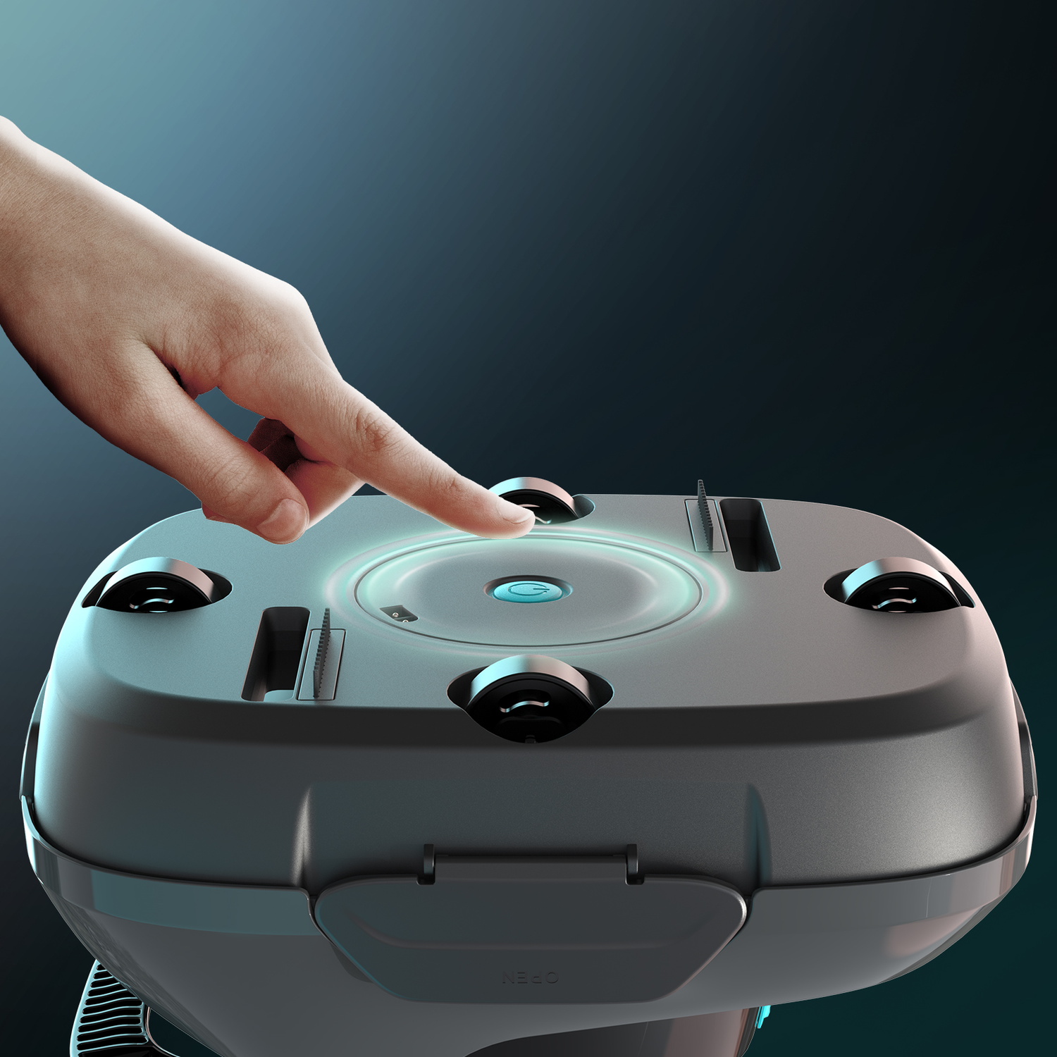 Hand touching a circular button on a gray device. Blue light shines.