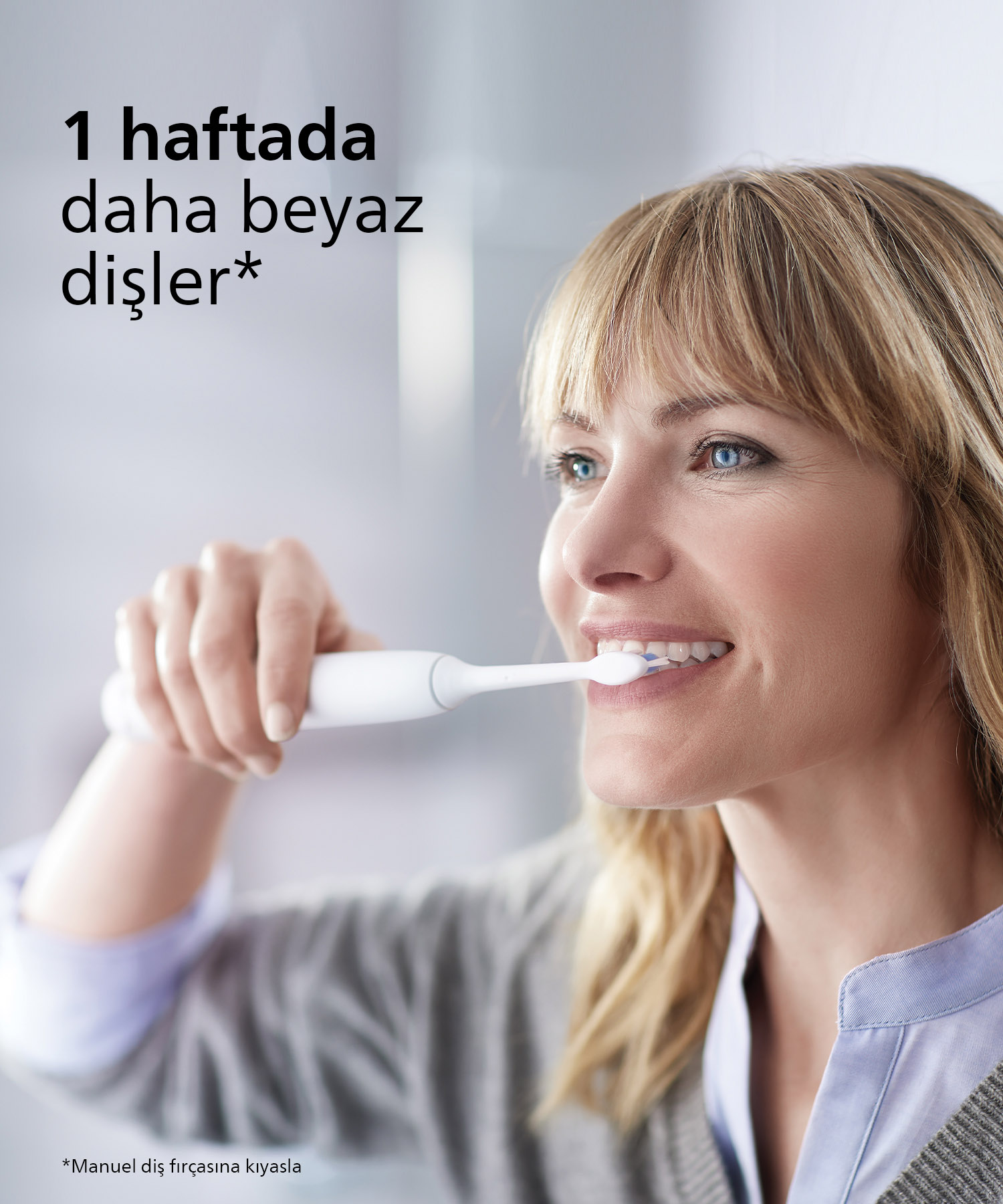 Kadın elektrikli diş fırçasıyla dişlerini fırçalıyor; metin: '1 haftada daha beyaz dişler'.