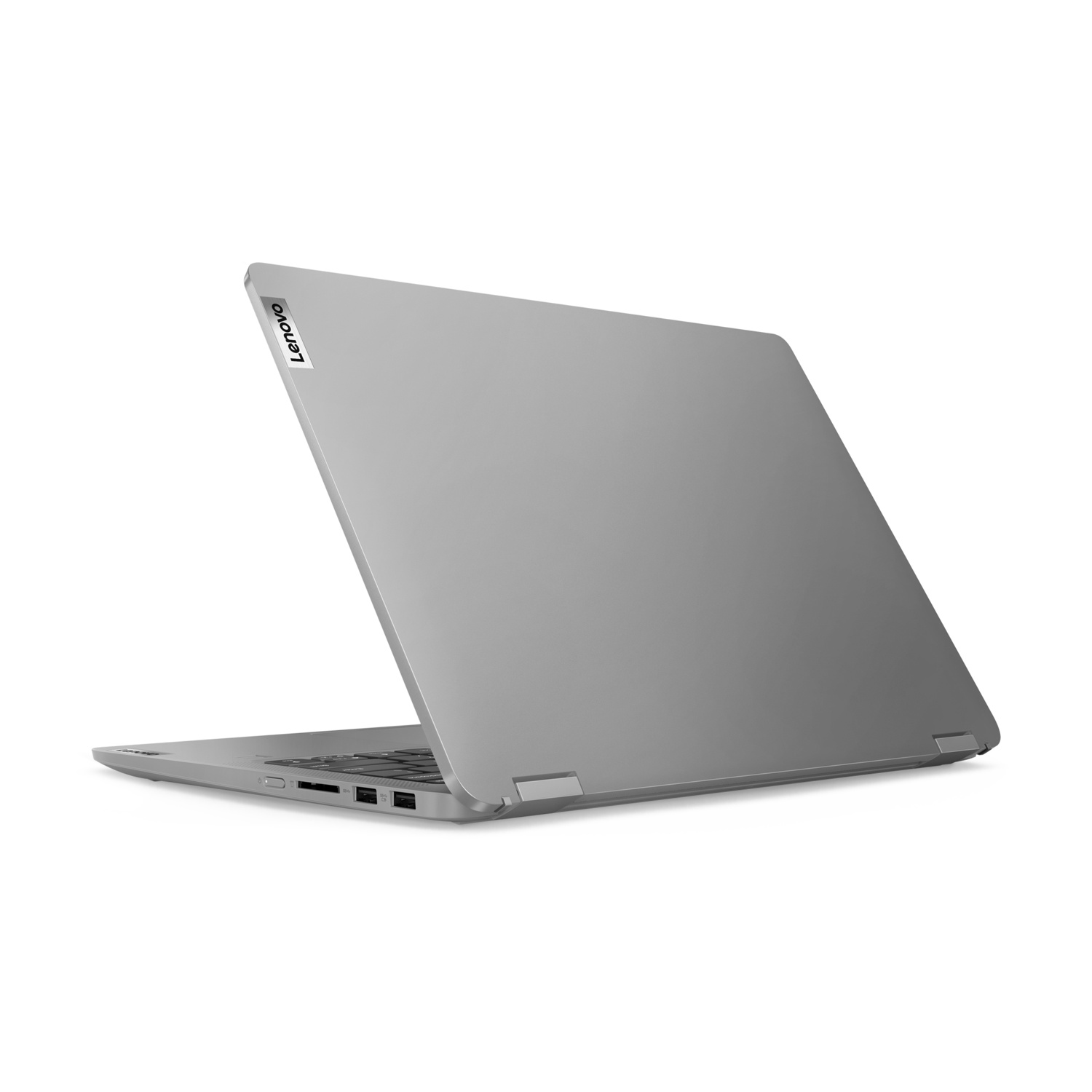 Un laptop grigio è aperto, vista posteriore, con il logo Lenovo visibile.