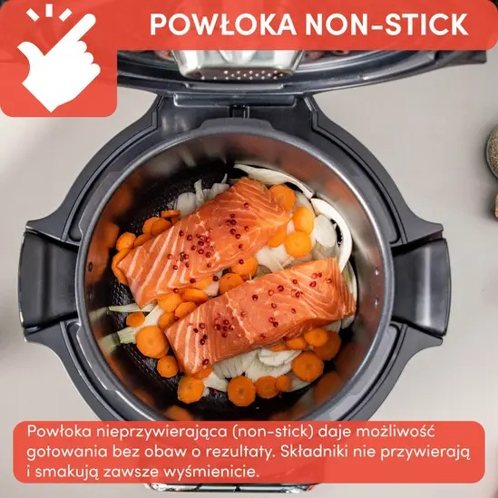Otwarty garnek z łososiem i warzywami. Tekst wskazuje powłokę nieprzywierającą. Jedzenie w środku.