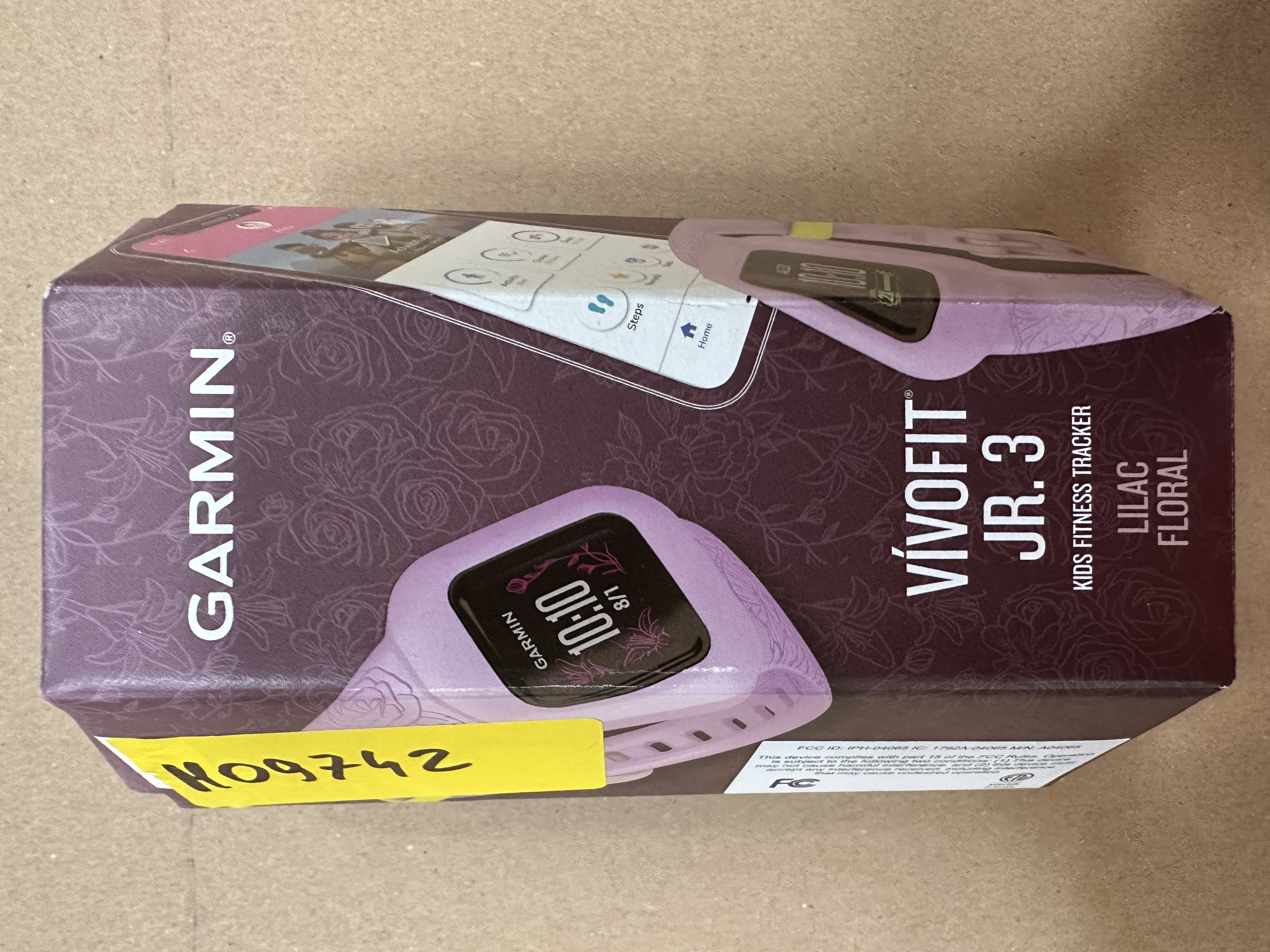 Pudełko z monitorem aktywności dla dzieci Garmin Vivofit Jr. 3, liliowy kwiatowy wzór.