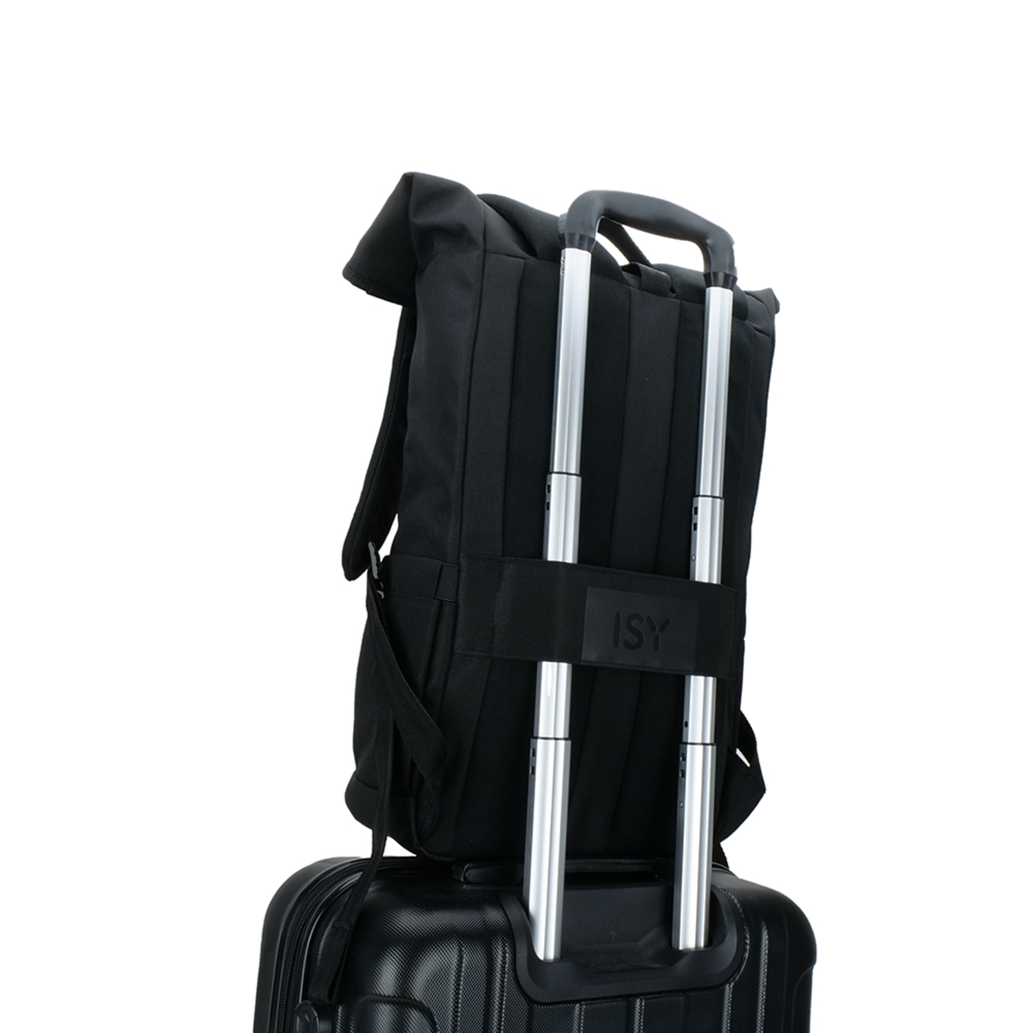 Black backpack on a black suitcase with a silver handle. The backpack is attached to the handle.