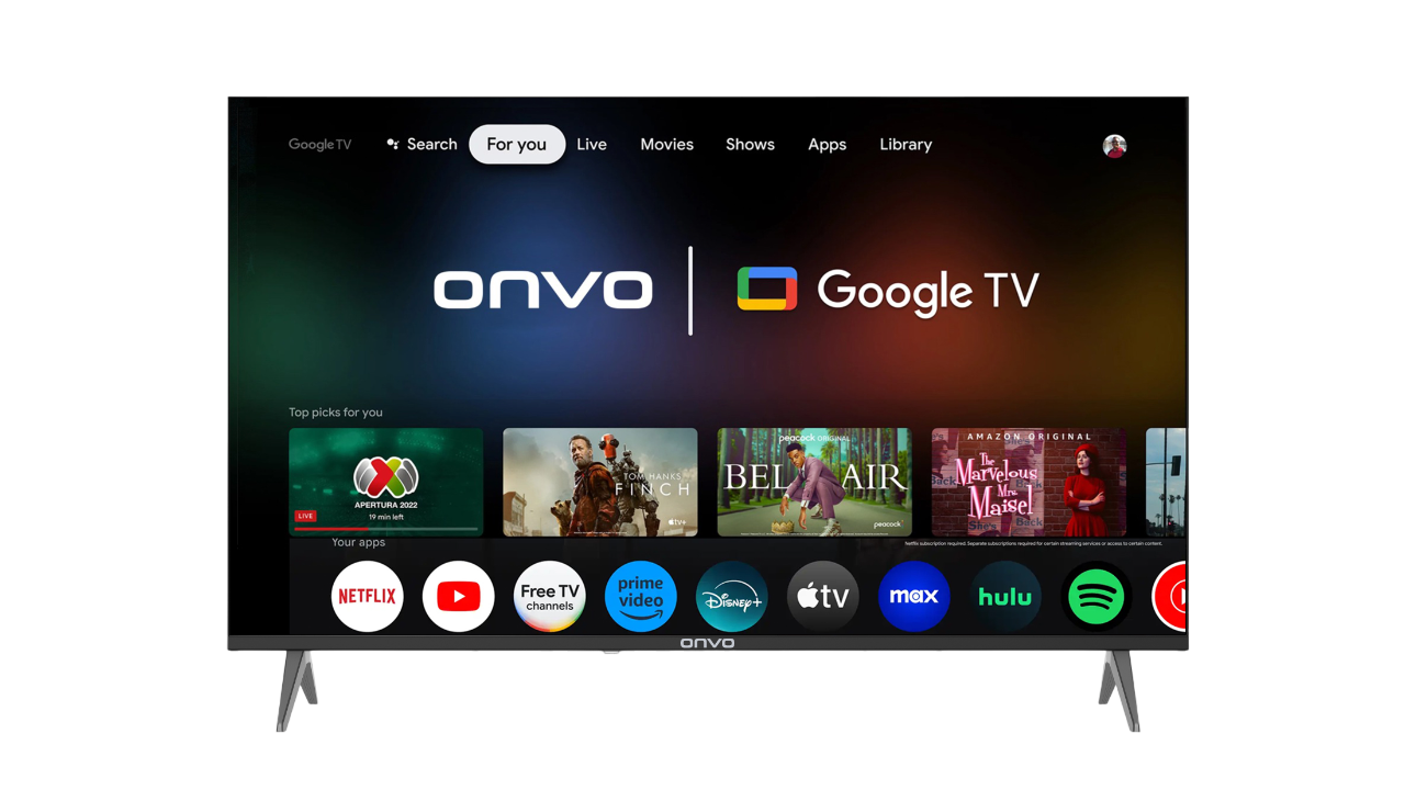 Onvo Google TV ekranı canlı TV, filmler ve uygulamalar gösteriyor. Siyah çerçeve, gümüş ayaklar.
