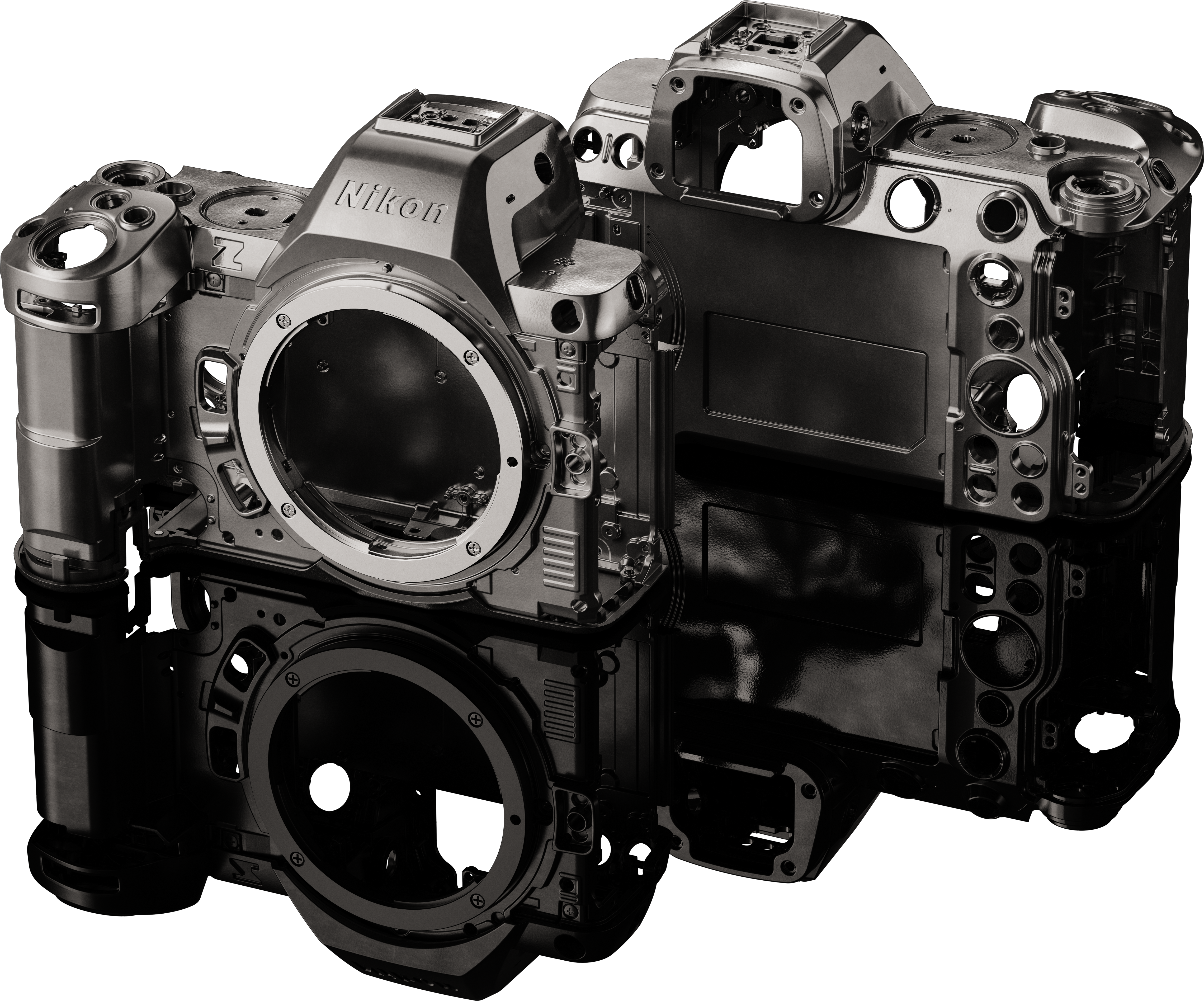 Zerlegter Kamerabody. Metallic-Grau. Nikon-Logo ist sichtbar.