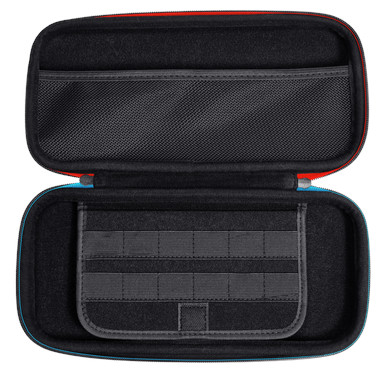 Otwarta obudowa z grami i akcesoriami. Schemat kolorów czerwony, niebieski i czarny.