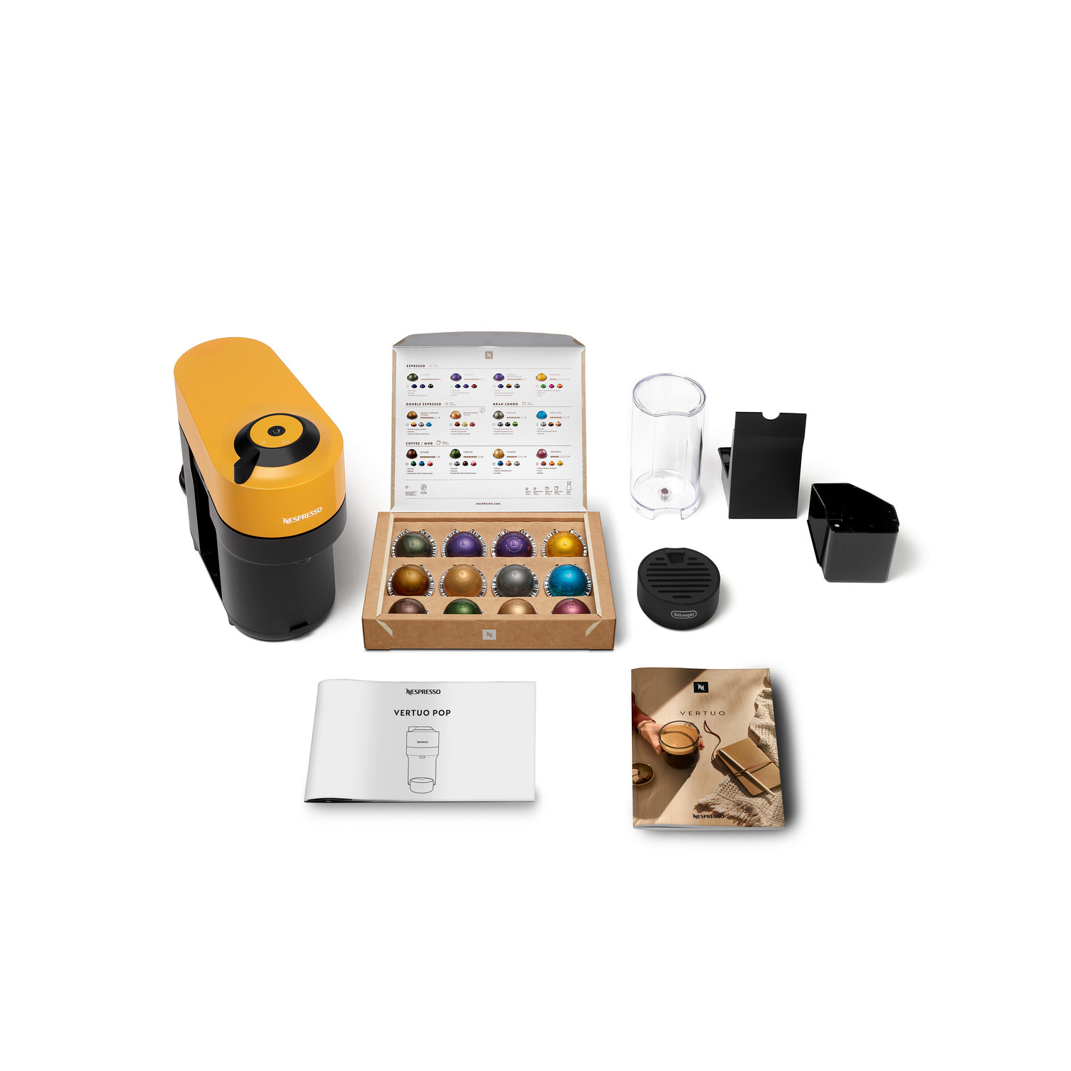 Nespresso coffee machine and accessories, including capsules and a water container.