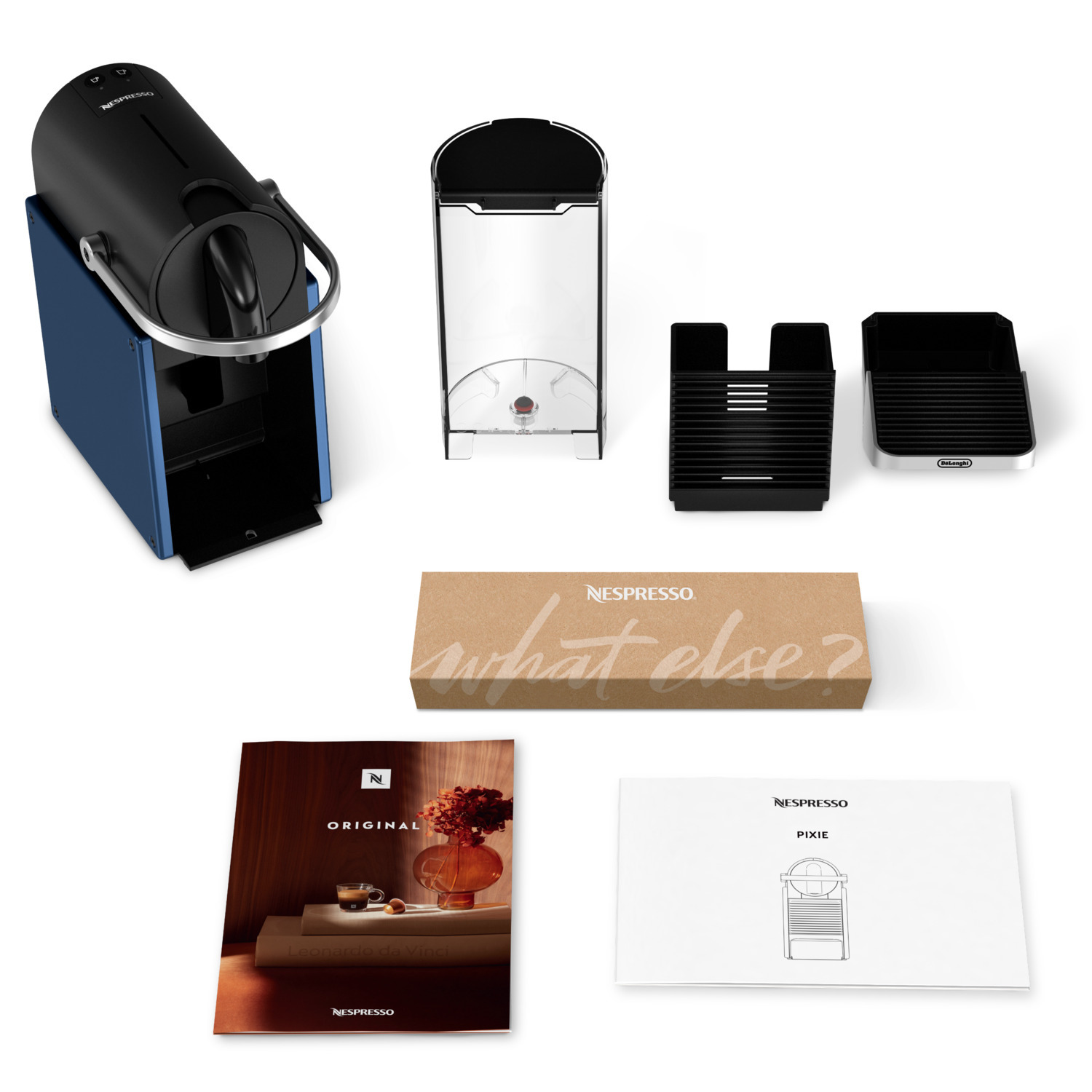 Nespresso coffee machine components laid out with some instruction manuals.