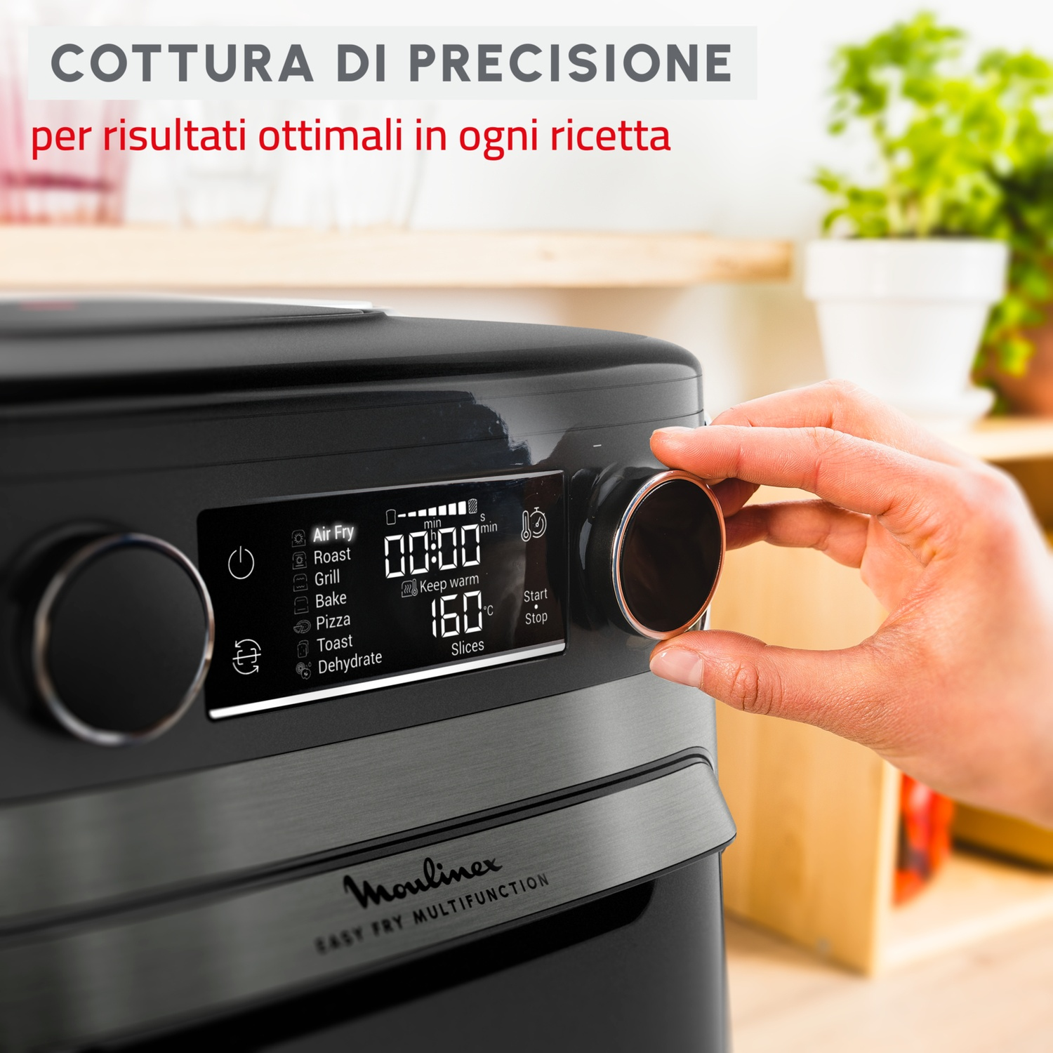 Una mano gira un quadrante su una friggitrice ad aria nera, con display di tempo e temp.