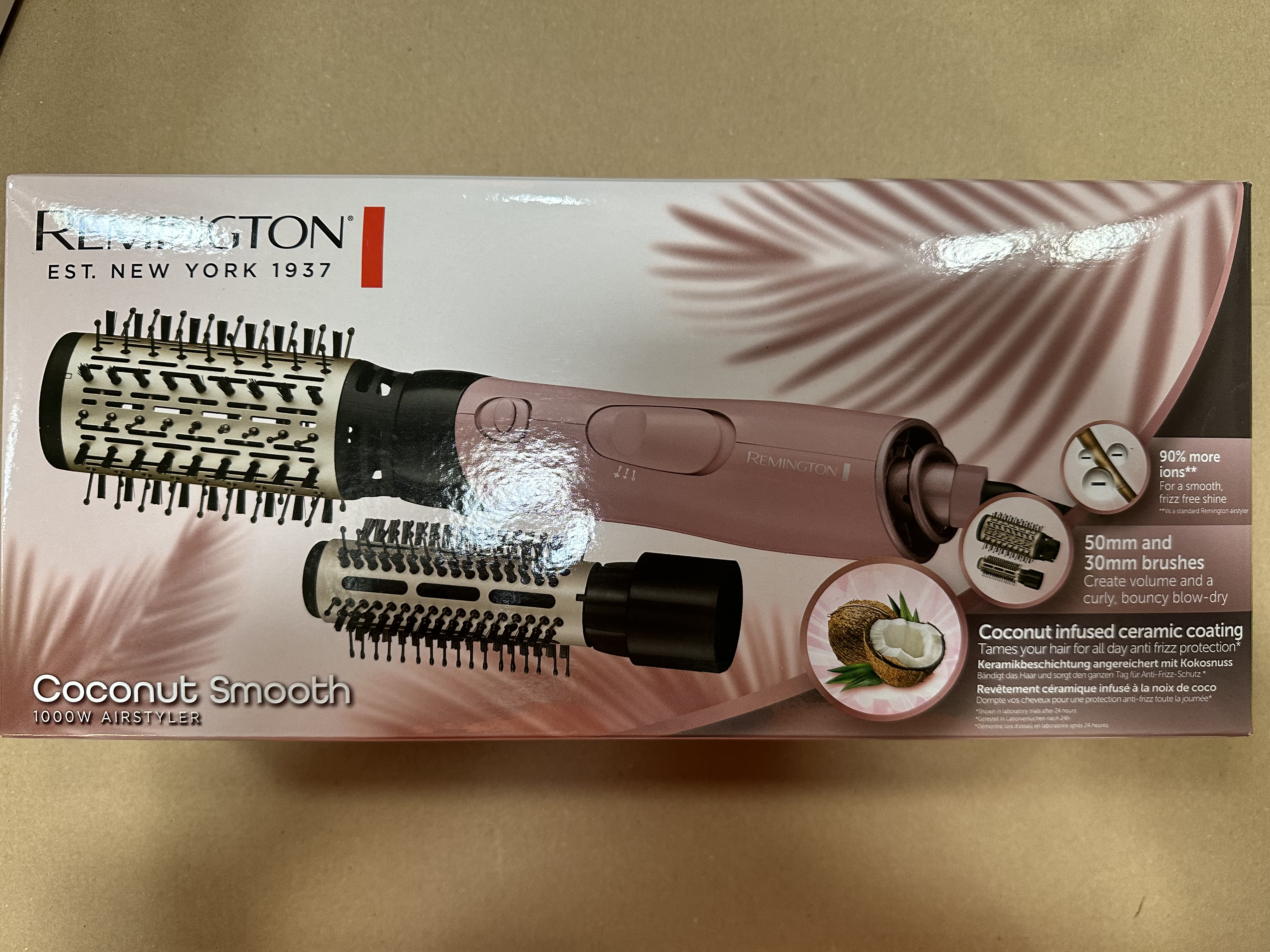 Pudełko stylizatora do włosów Remington Coconut Smooth, pokazujące produkt i jego cechy.