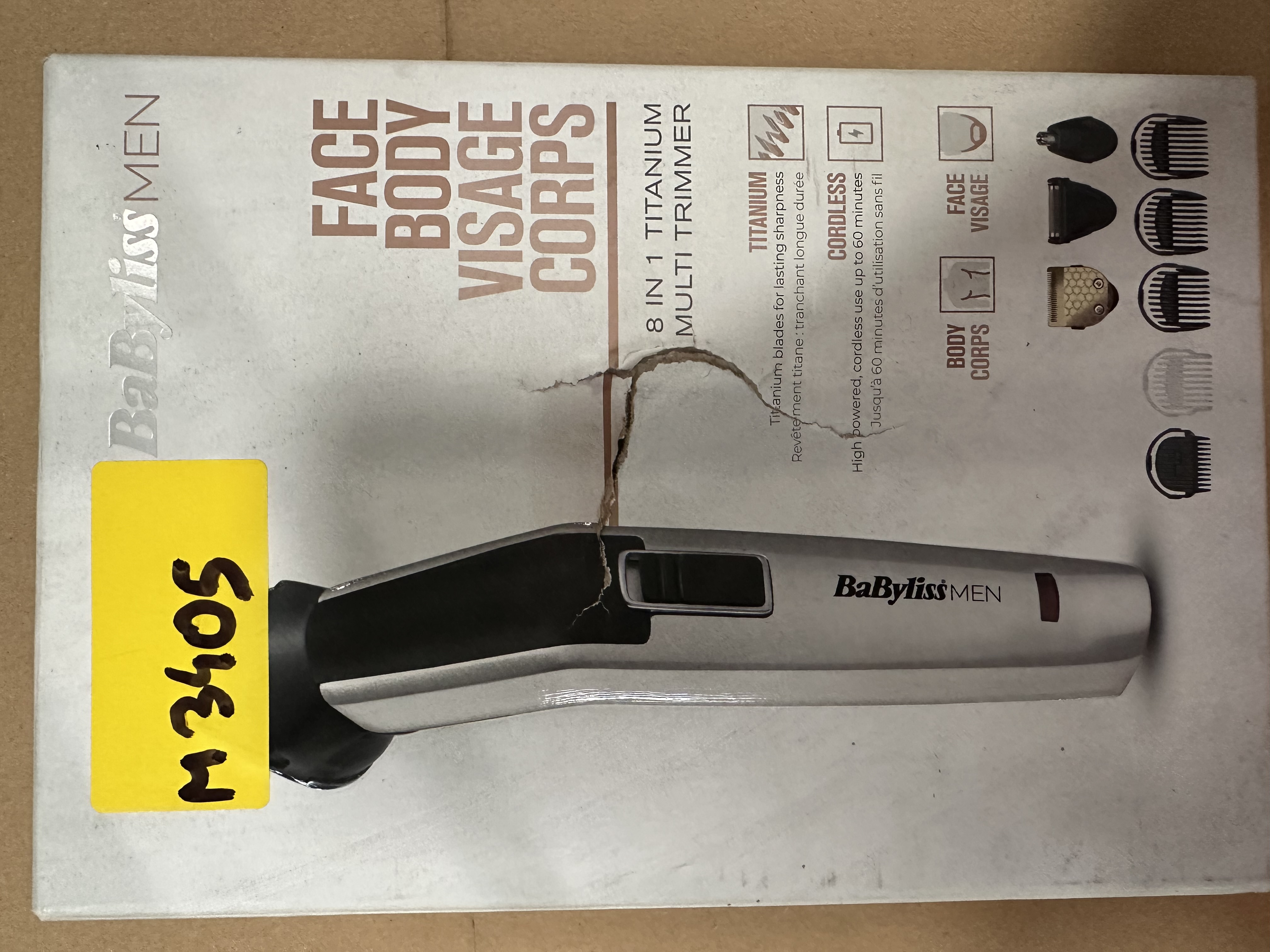 Zapakowana trymer BaByliss MEN, żółta naklejka, białe tło.