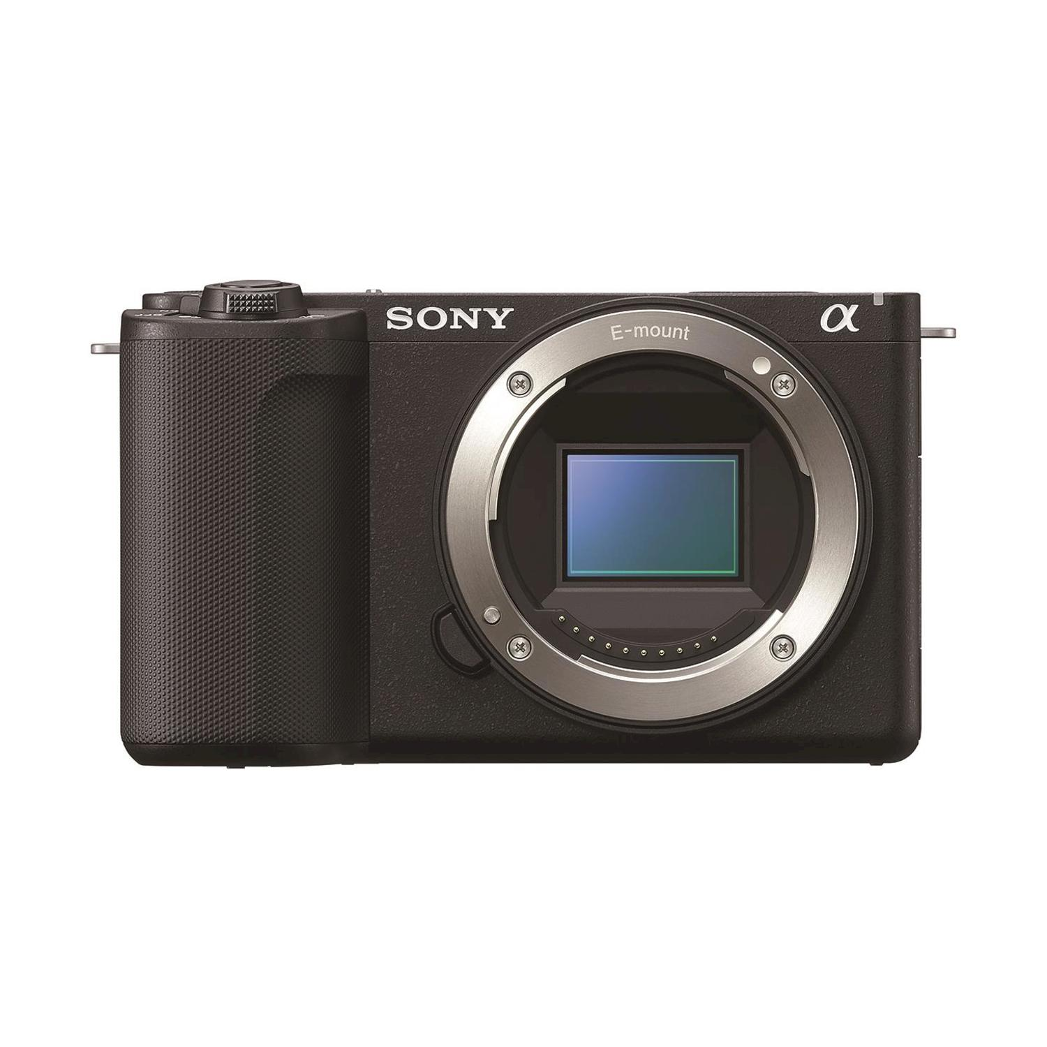 Fotocamera nera con obiettivo e anello argentato.