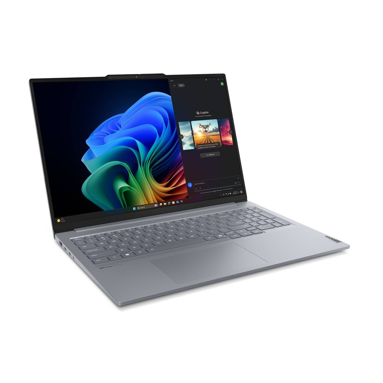Silver laptop with a color screen. A white background. Windows Copilot interface visible.