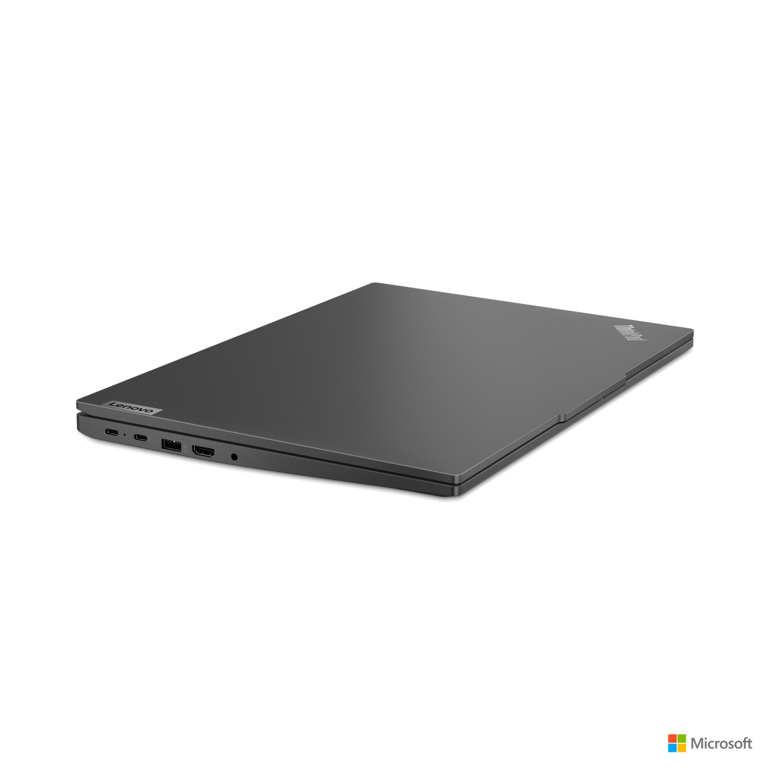 Gesloten zwarte Lenovo laptop op witte achtergrond. Microsoft logo rechtsonder.