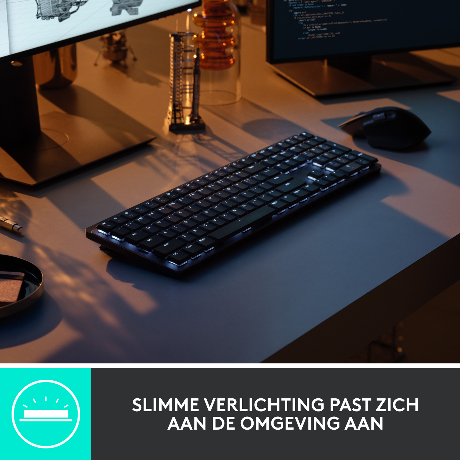 A black keyboard with white lit keys. A computer screen is in the background, with a mouse.