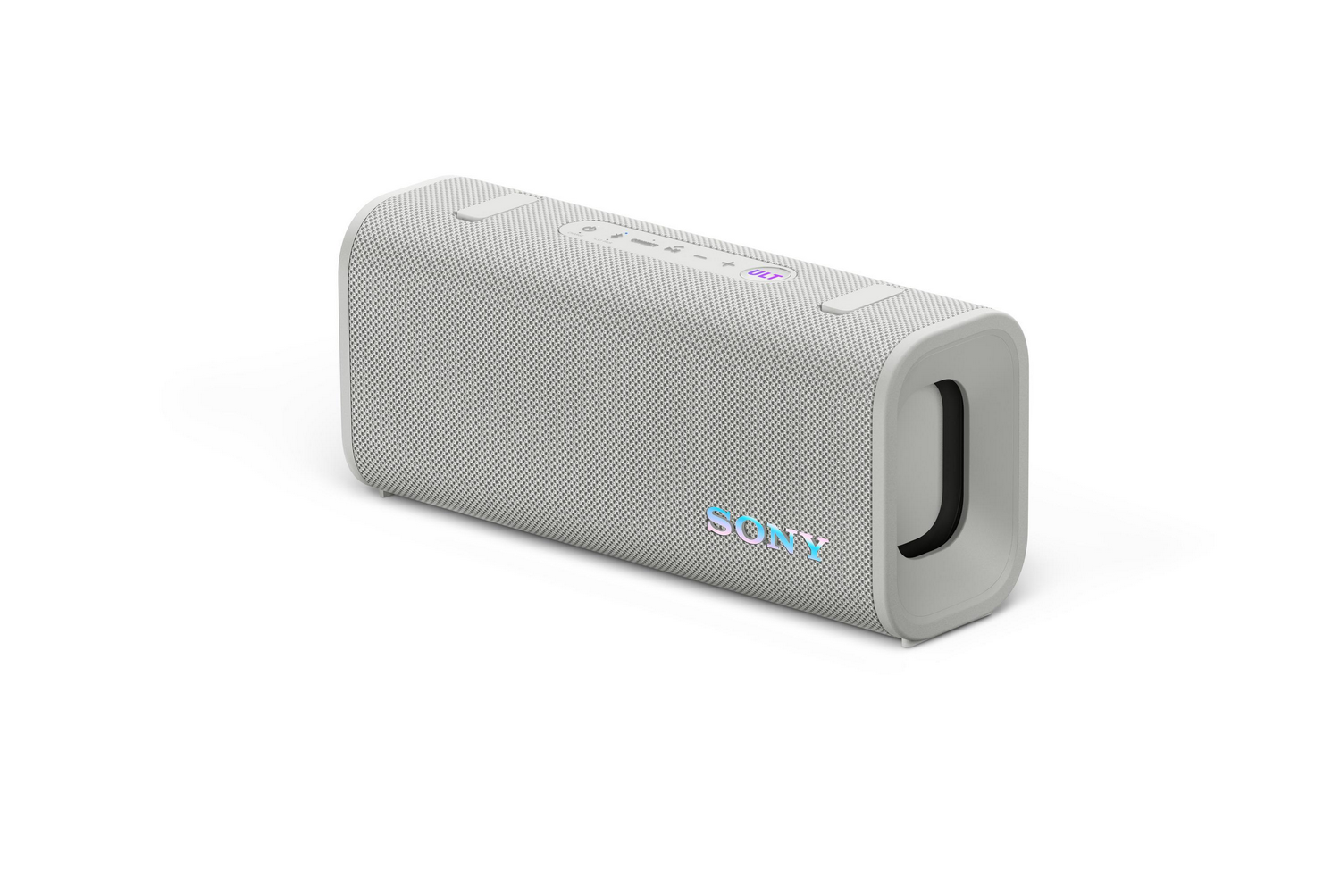 Altavoz Sony gris, rectangular, fondo blanco, botones arriba.