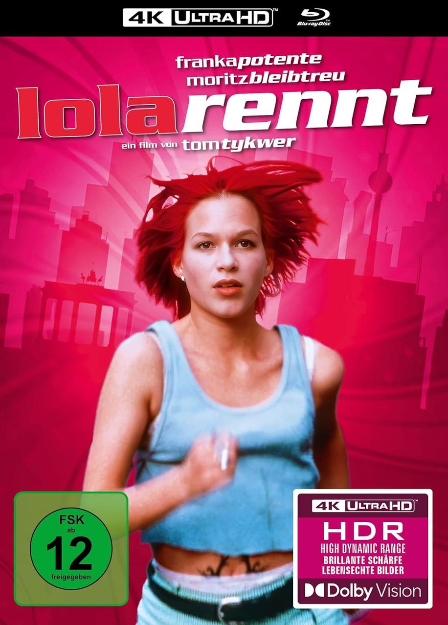 Lola rennt Filmcover. Frau rennt, rotes Haar. Titel oben. Filmtitel auf dem Cover.