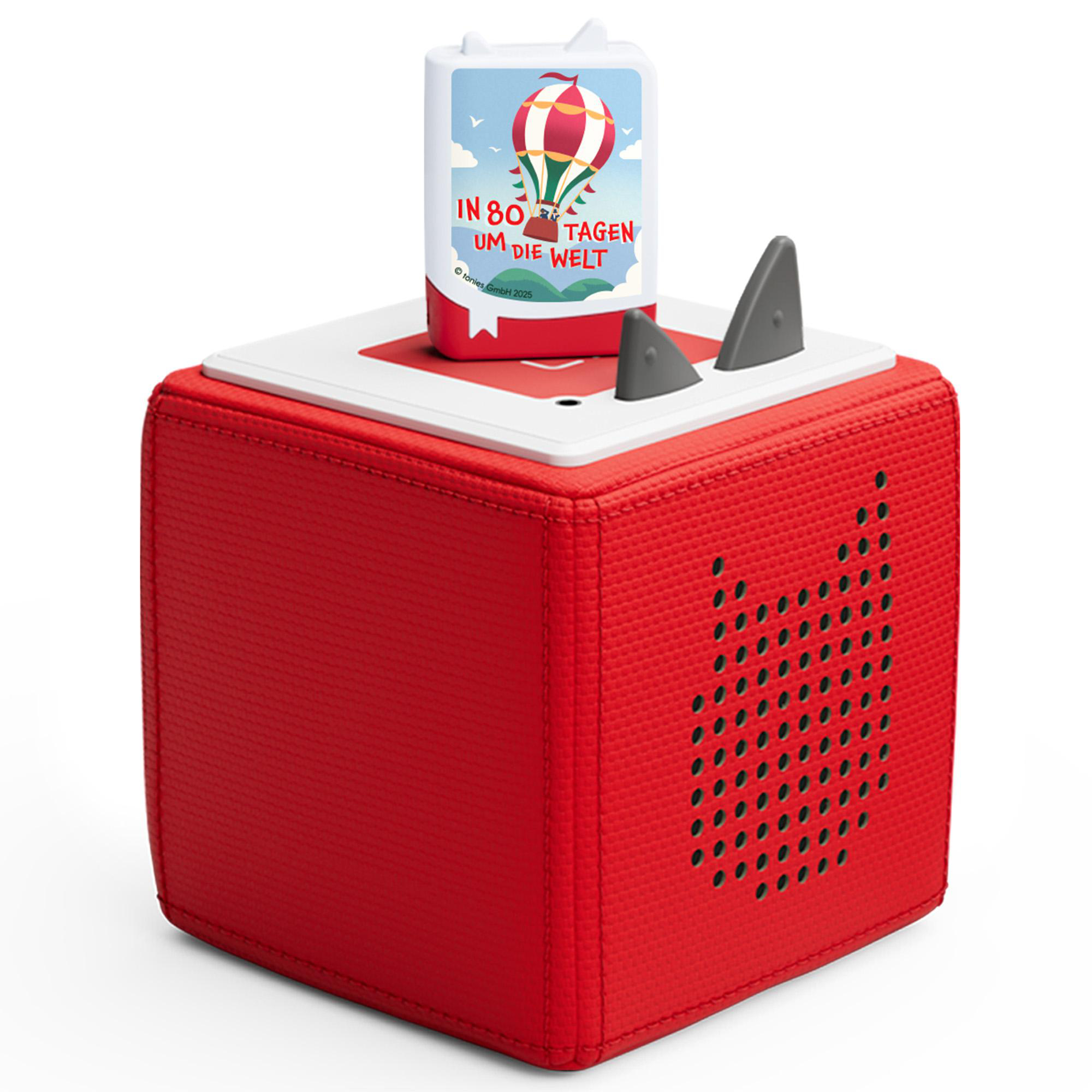 Eine rote, würfelförmige Toniebox mit einer Figur oben, mit Heißluftballon-Design.