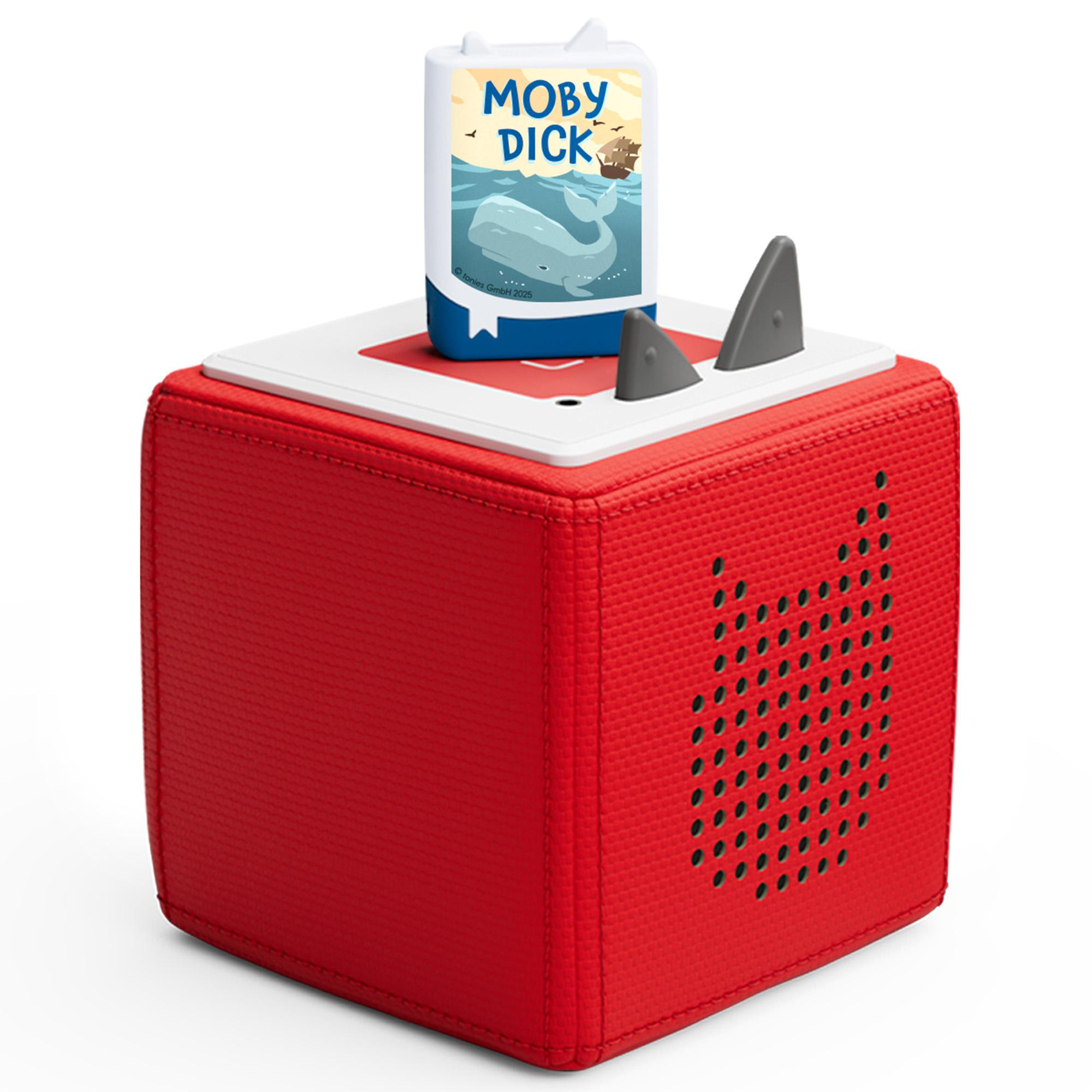 Eine rote Toniebox mit einer buchförmigen Figur. Das Buch trägt den Titel Moby Dick.