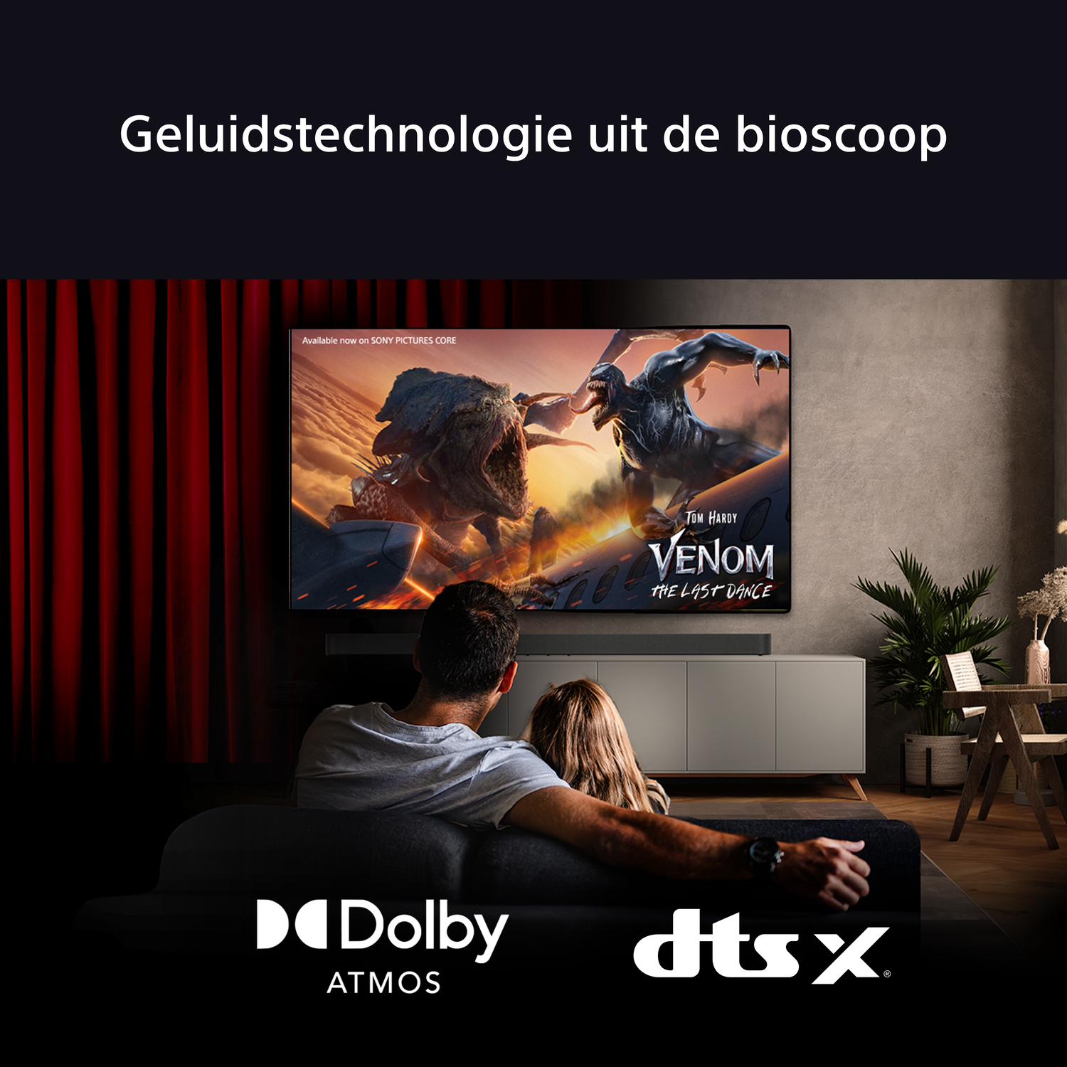 A living room with a TV showing a movie. A couple is sitting on a couch. The room has a modern design.