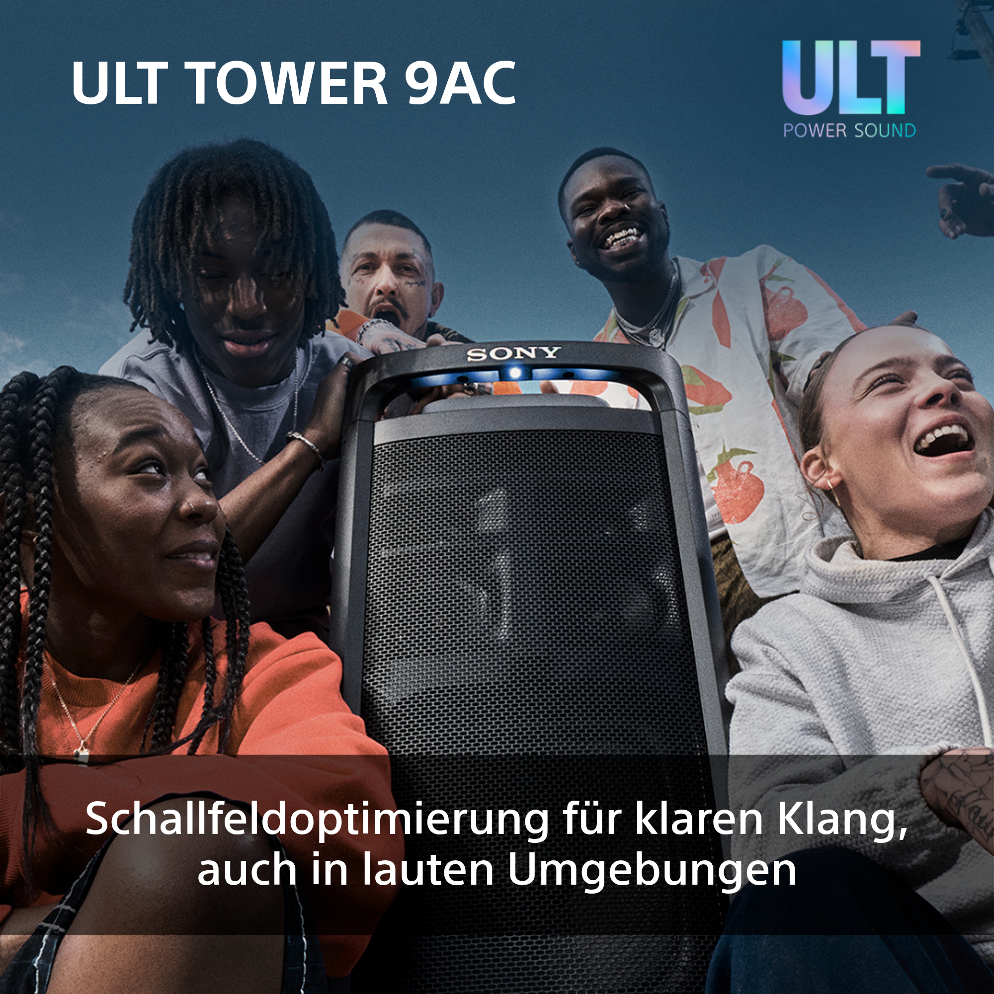 Eine Gruppe von Leuten betrachtet einen Sony ULT Tower 9AC Lautsprecher. Der Lautsprecher ist schwarz.