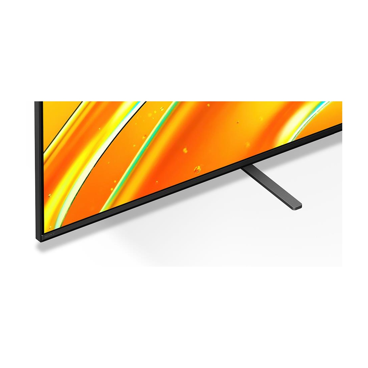 Una TV, con cornice e supporto neri, mostra un'immagine arancione e gialla.